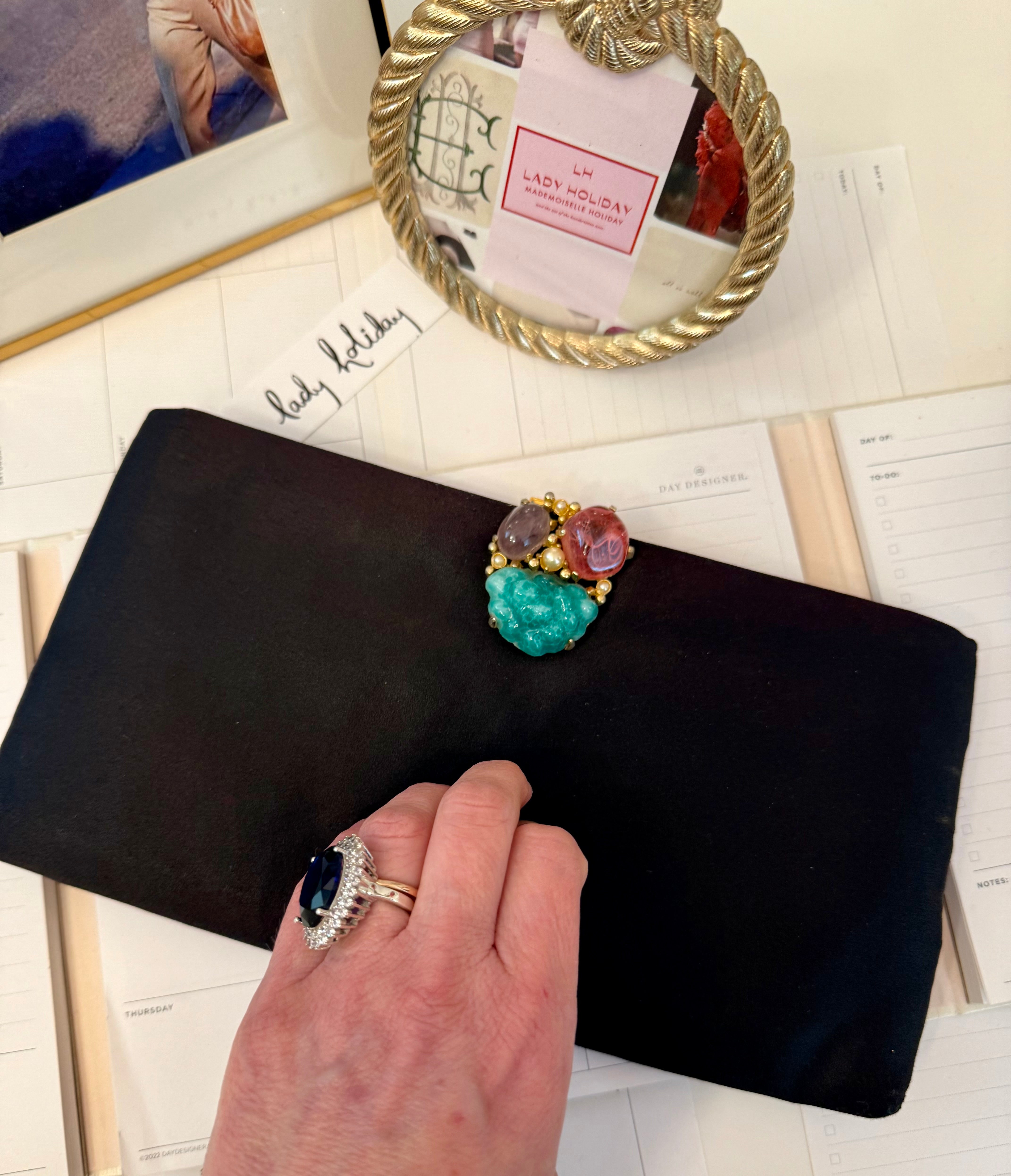 The most chic black satin evening bag with the most divine adornment.