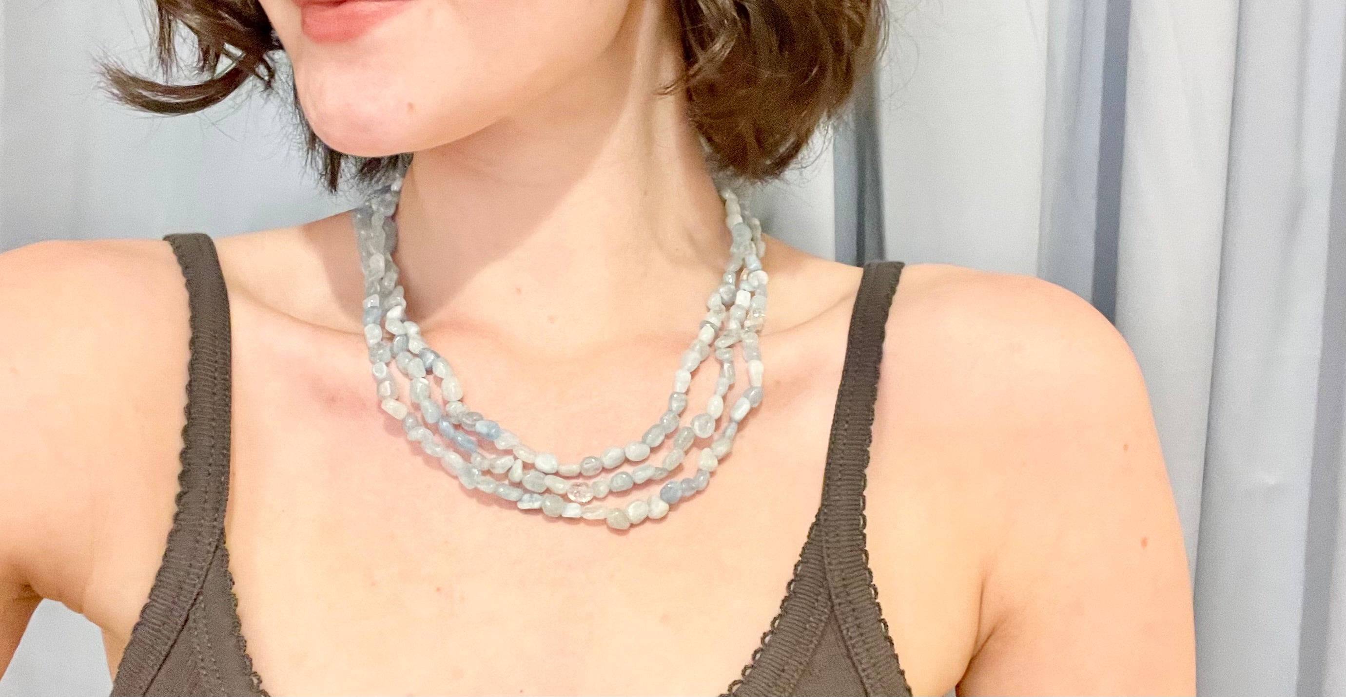 The most charming aquamarine glass beaded necklace... so feminine.