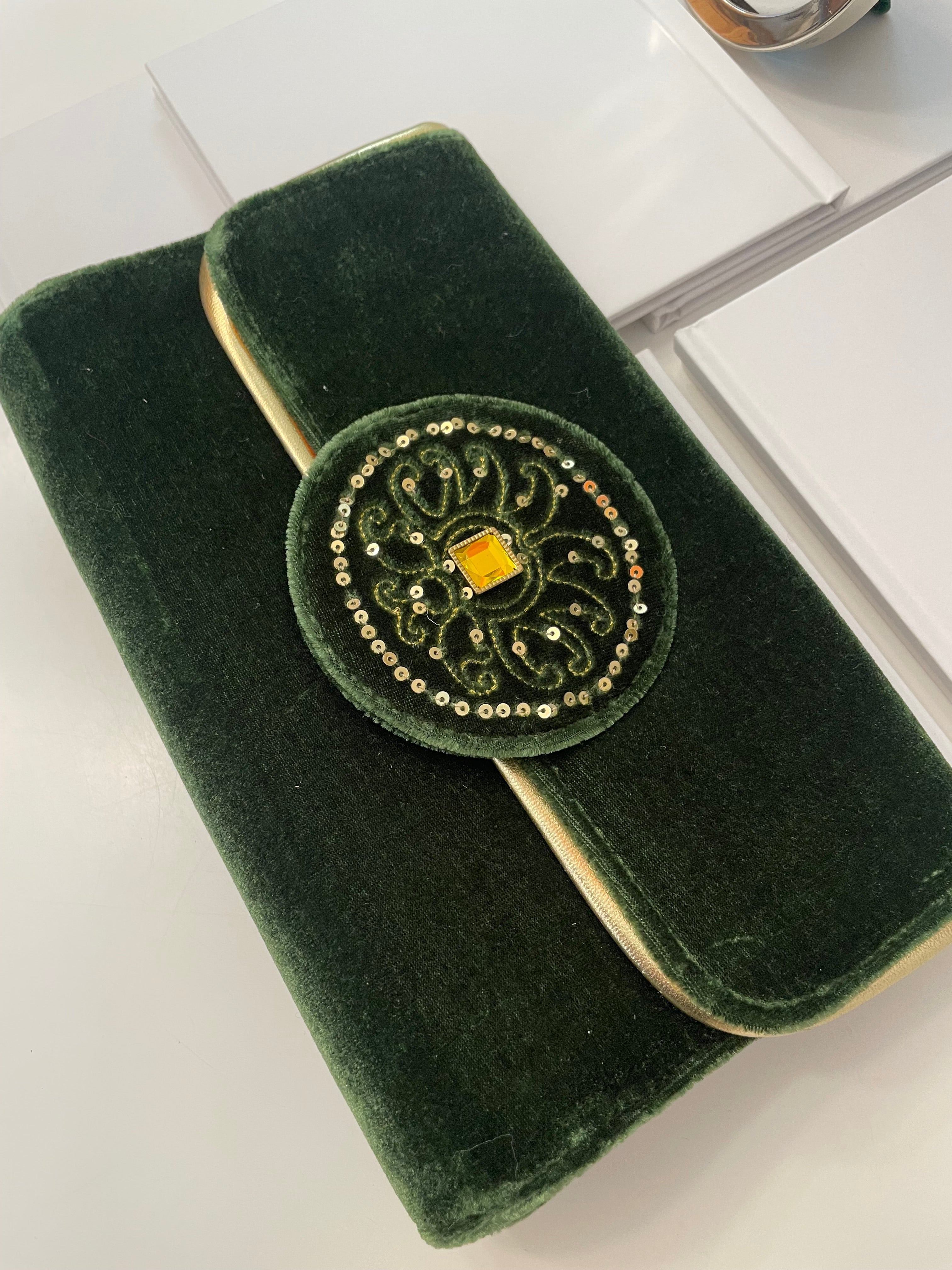 The most beautiful green velvet clutch bag, adorned with loveliest gold stone, and sequins... so elegant