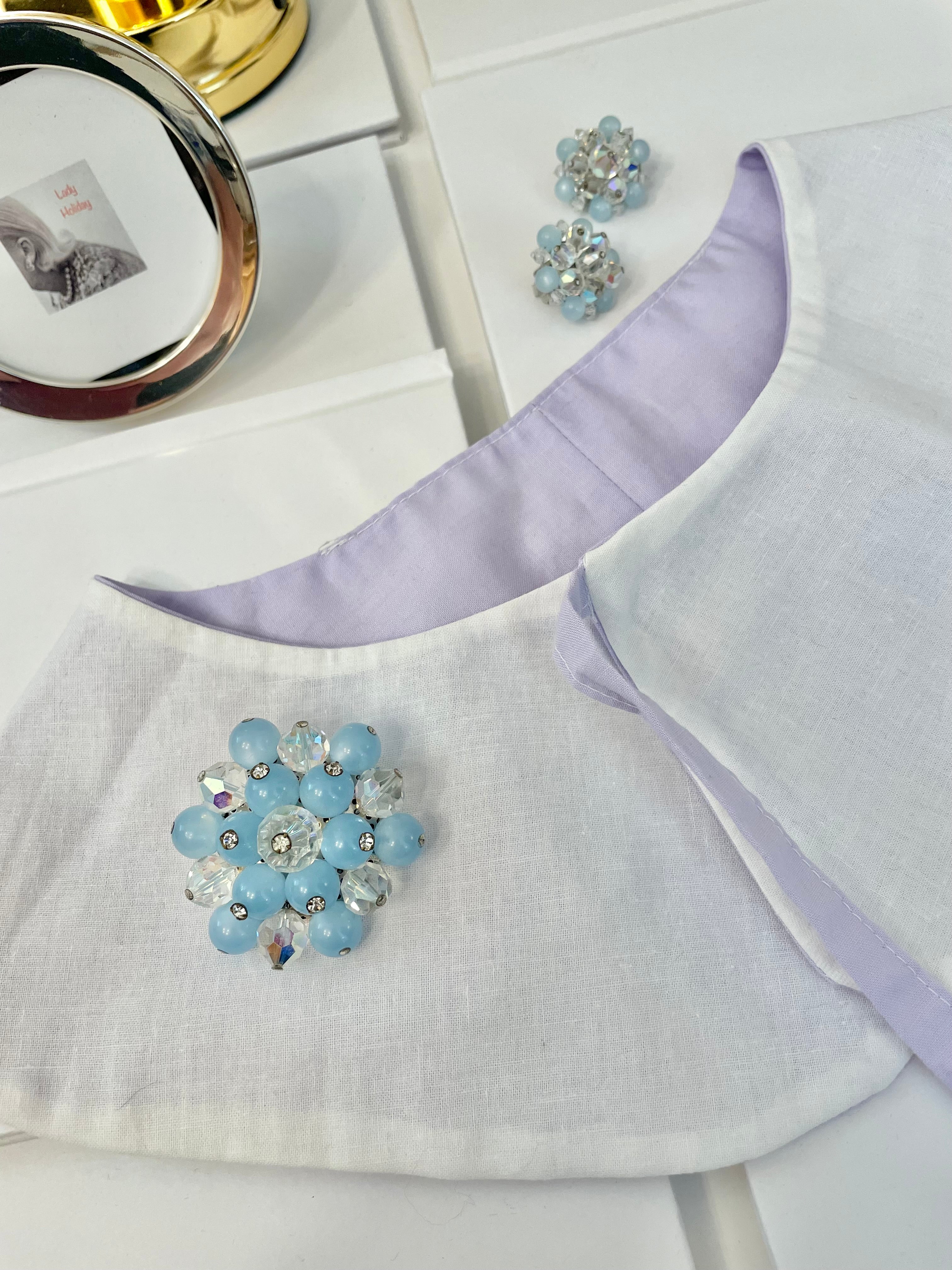1960's Heiress and her love of the classic brooch, and matching earrings. Oh my! The soft blue with Austrian crystals is truly divine.