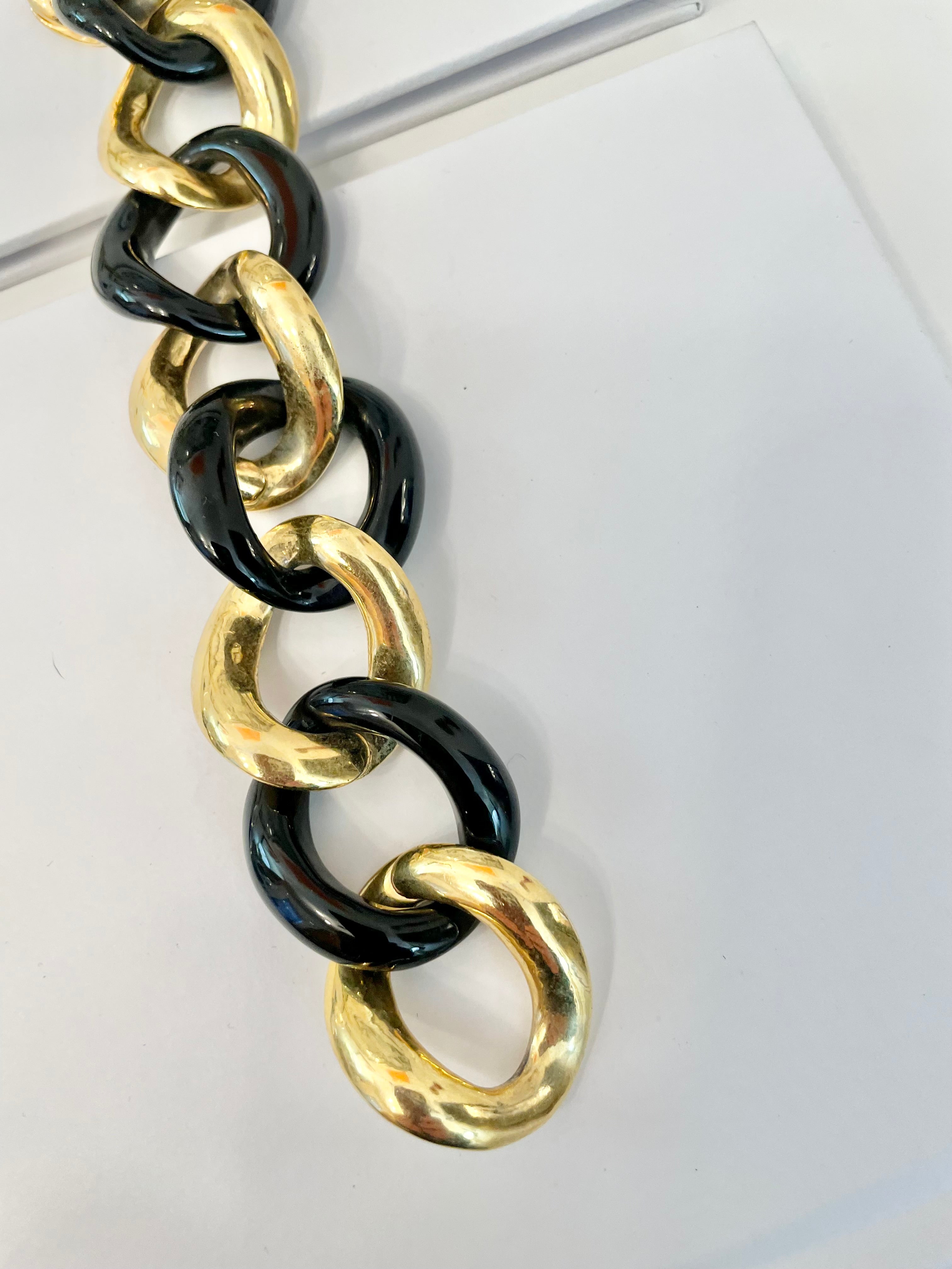 Lovely classic Kenneth Jay Lane noir and gold chunky link bracelet with super chic toggle closure.