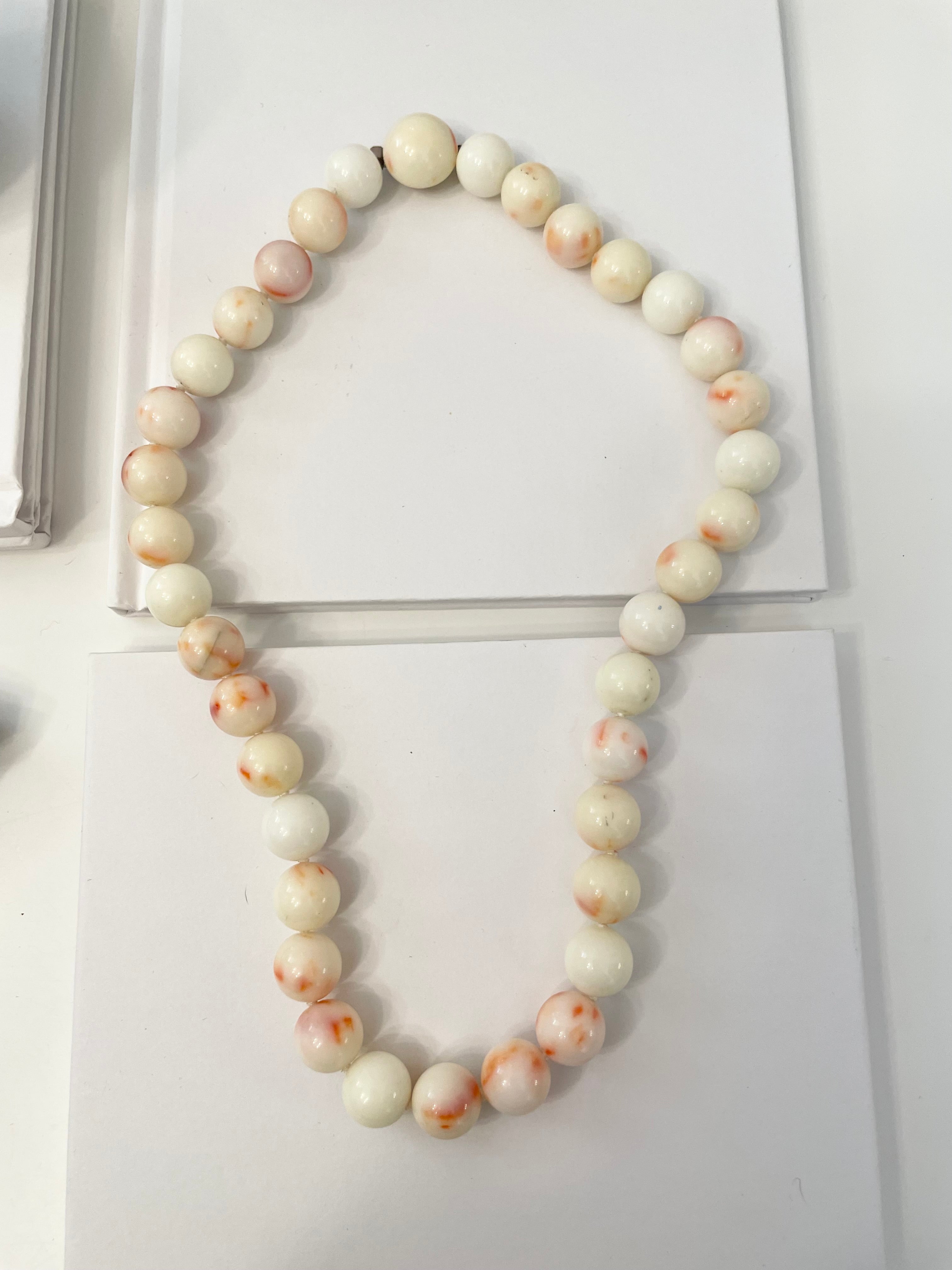 Oh so classy, faux angel skin coral lovely strand of beads... so feminine