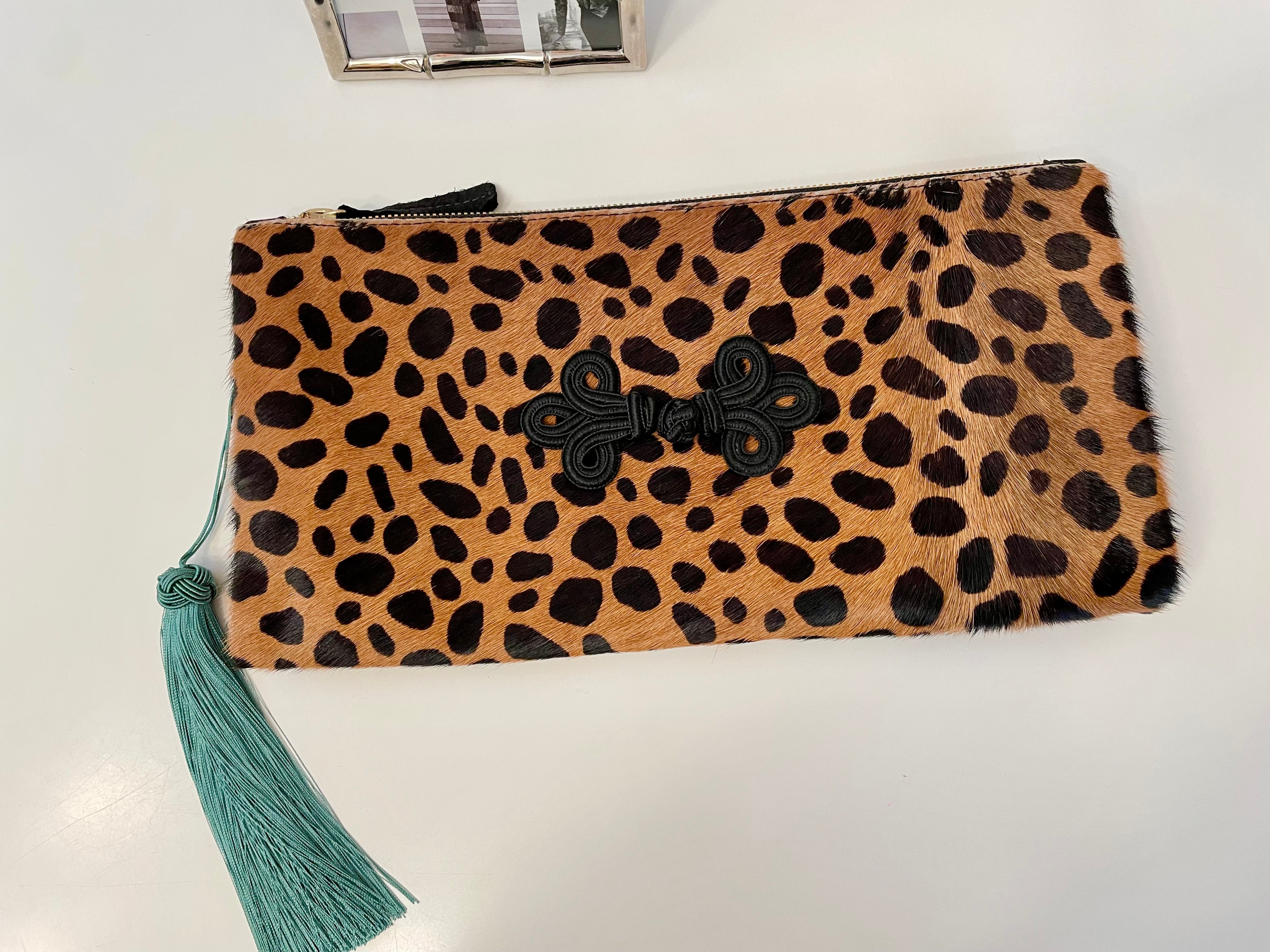 The most classy horse hair leopard print fold over bag with sassy tassel... so elegant