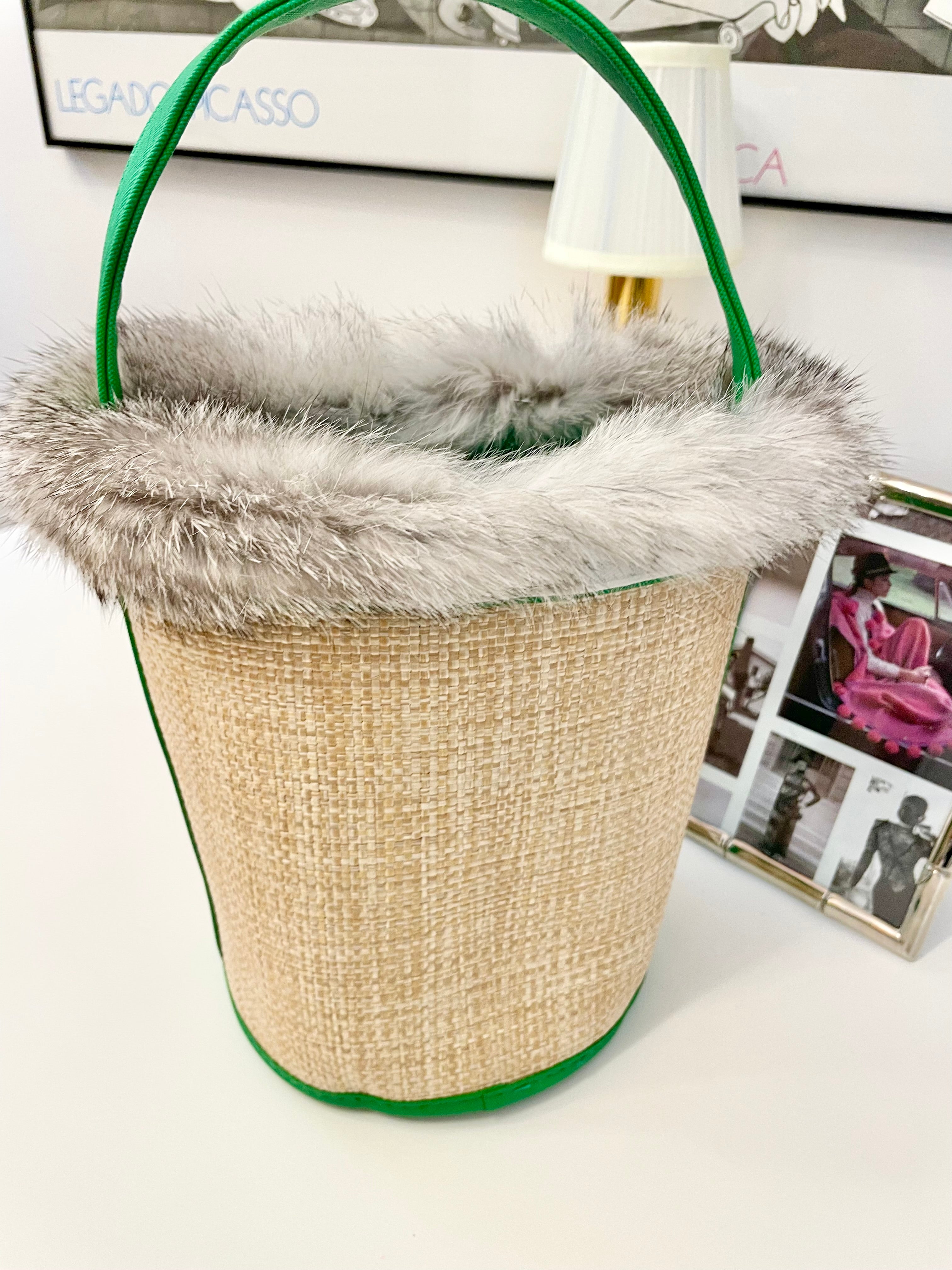 The most divine rattan bucket bag trimmed with vintage fox fur....