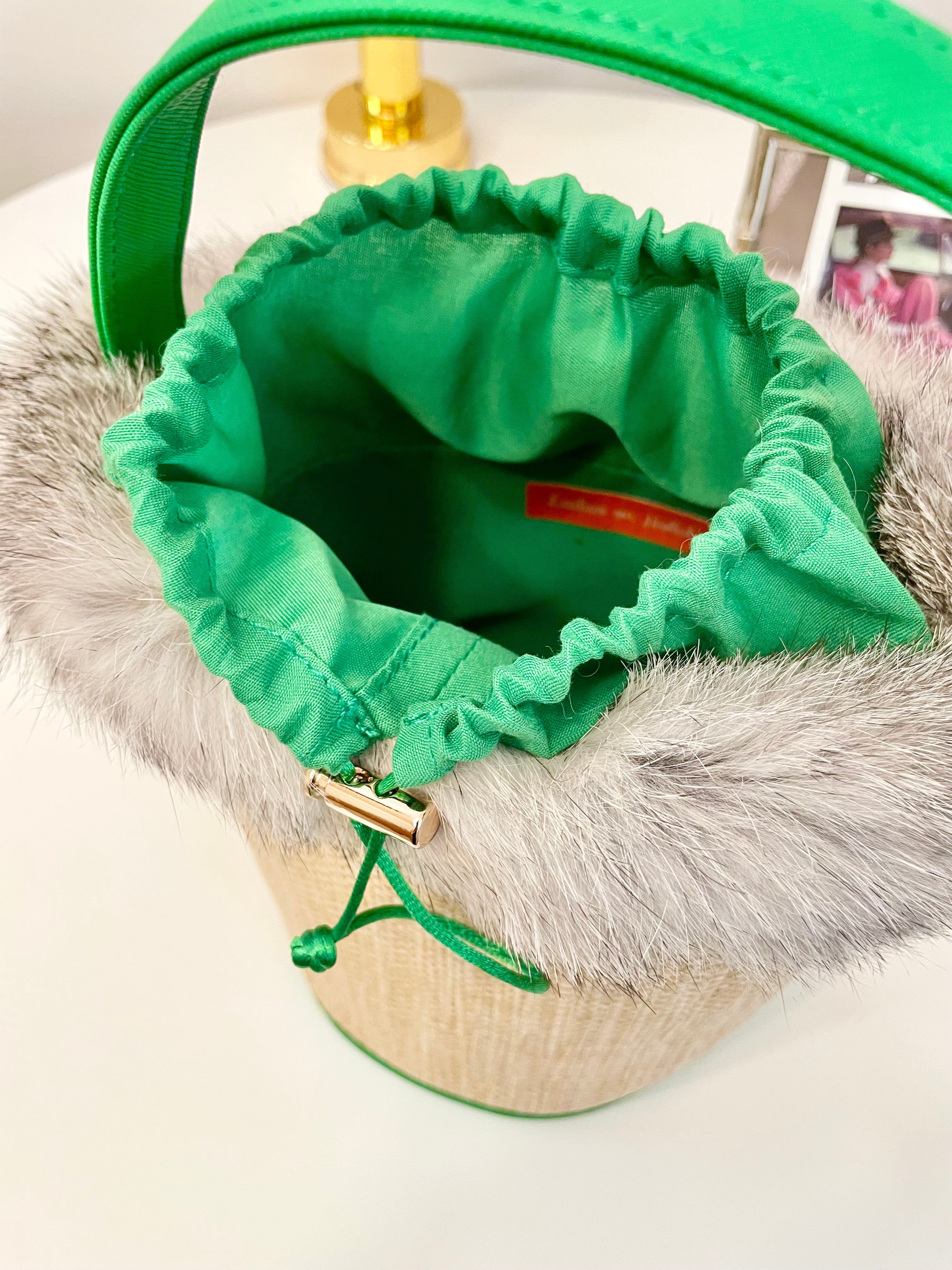 The most divine rattan bucket bag trimmed with vintage fox fur....