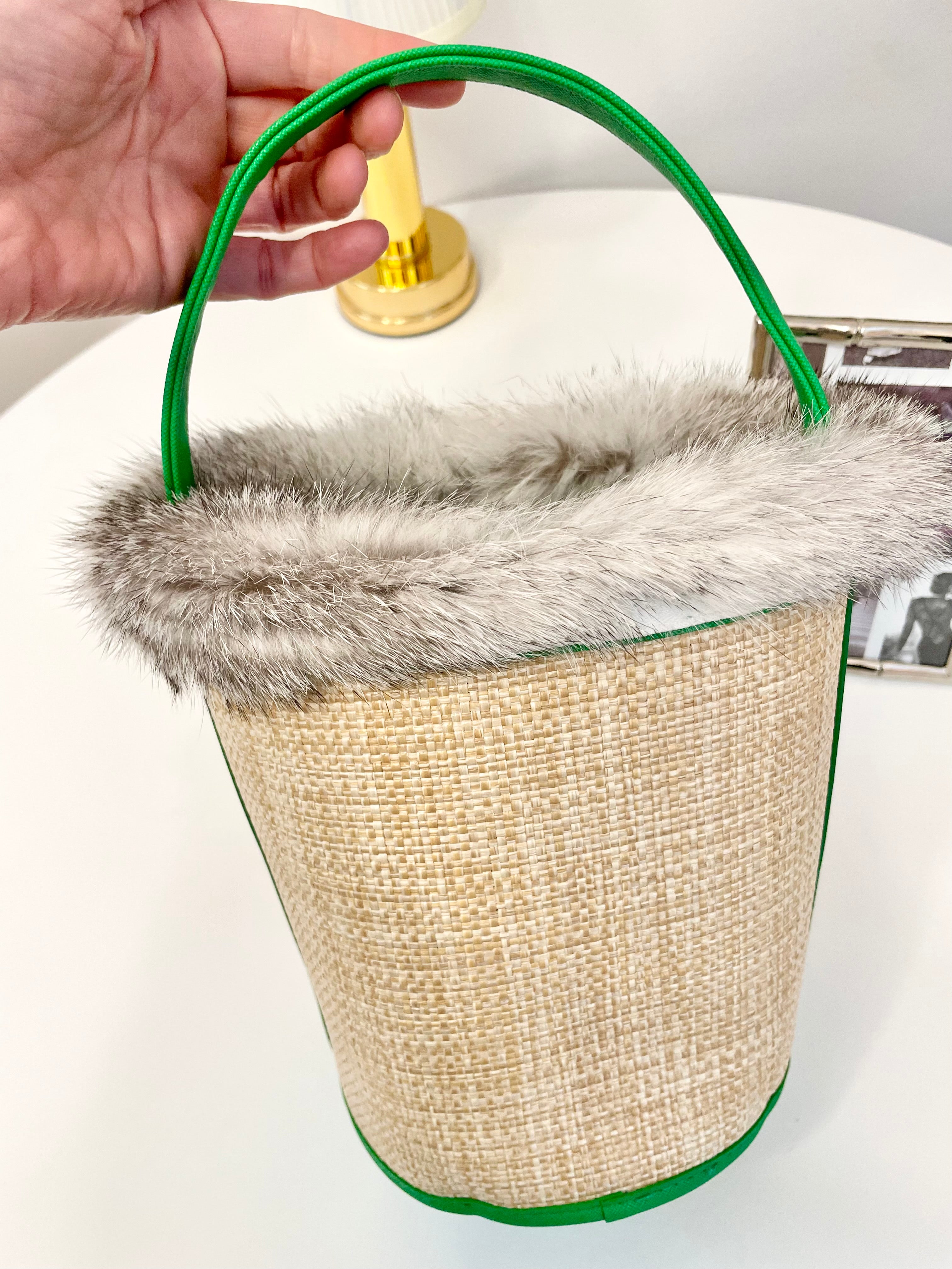 The most divine rattan bucket bag trimmed with vintage fox fur....