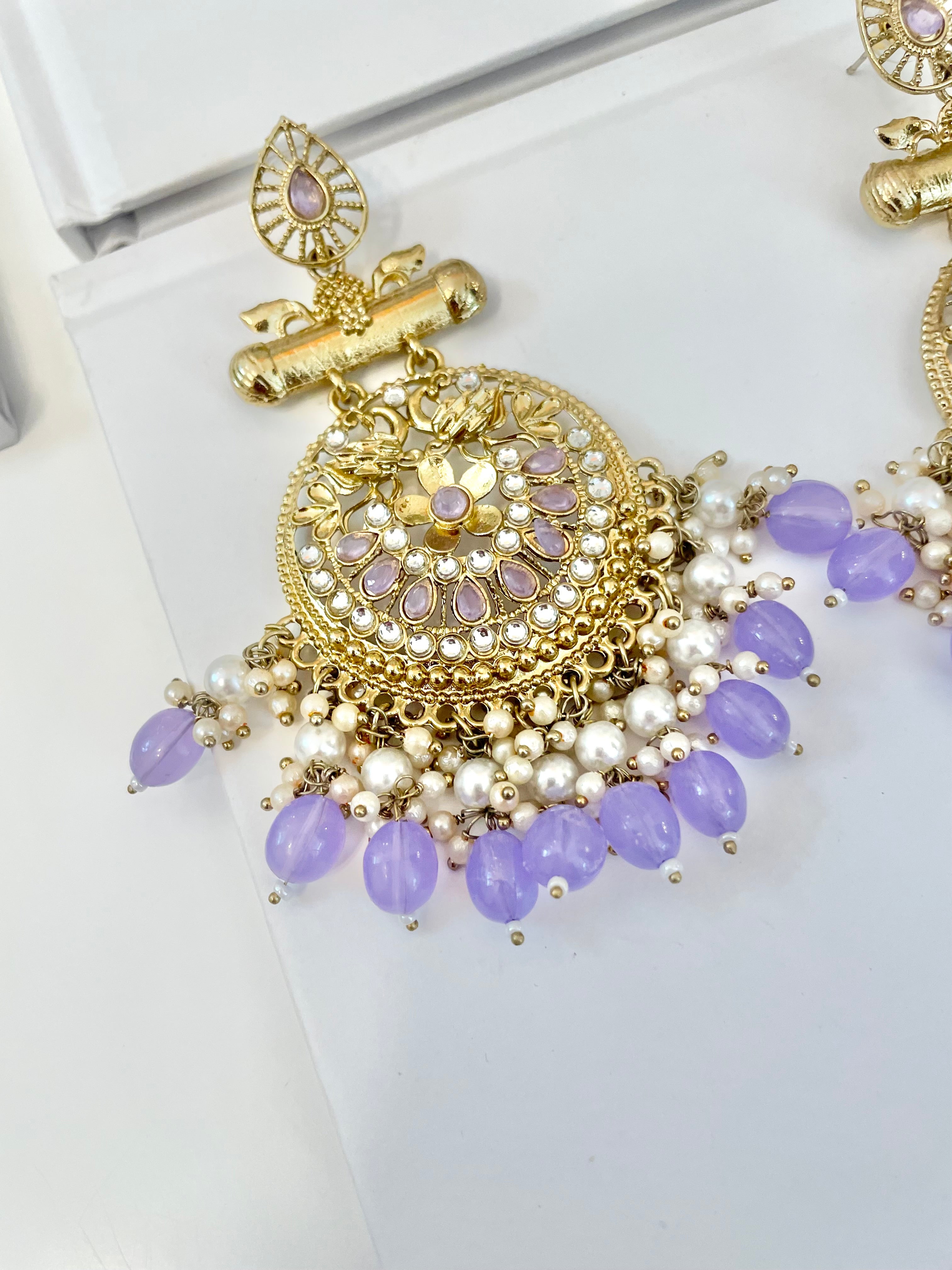 The most beautiful soft purple glass statement earrings....so feminine