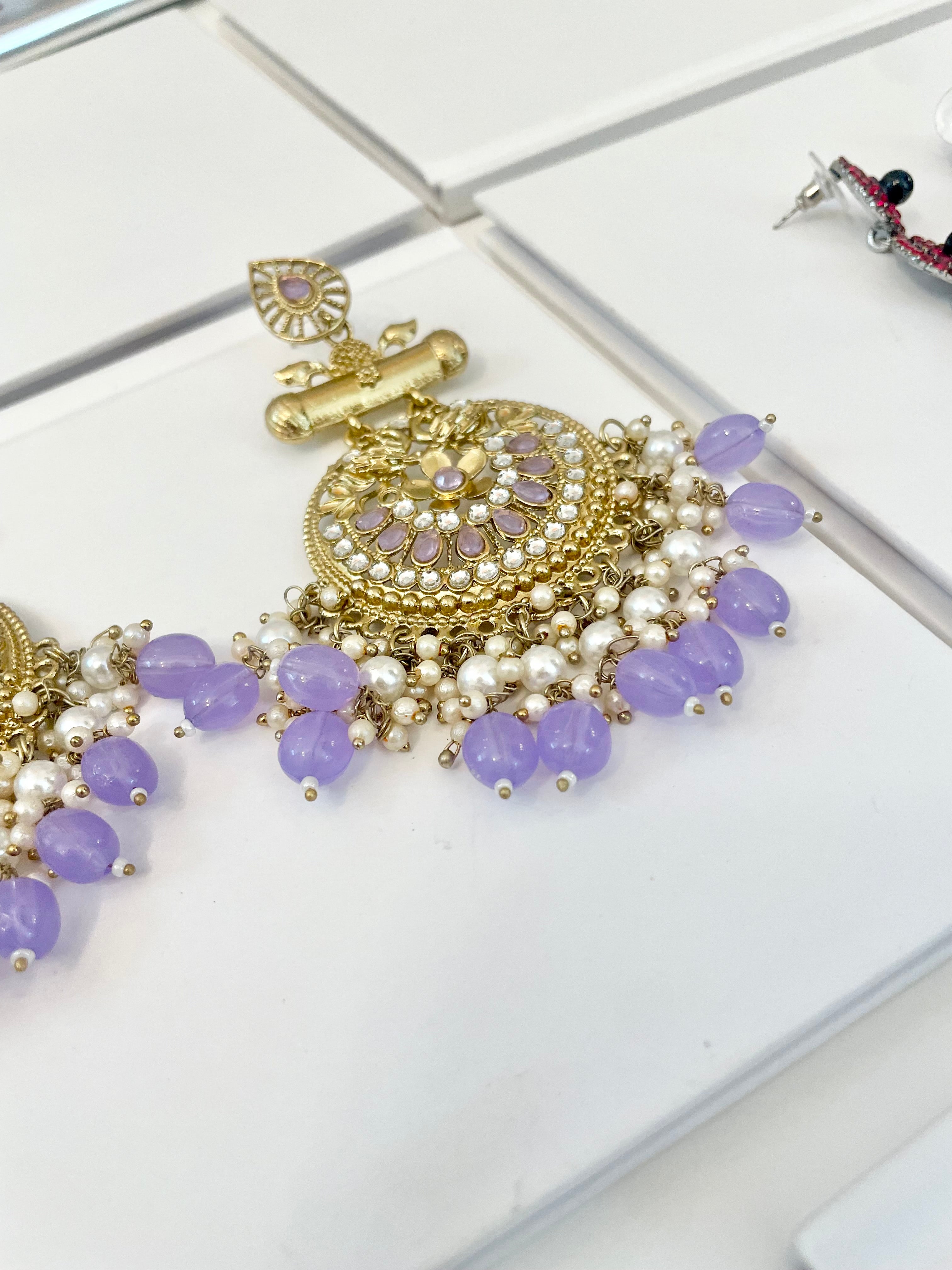 The most beautiful soft purple glass statement earrings....so feminine