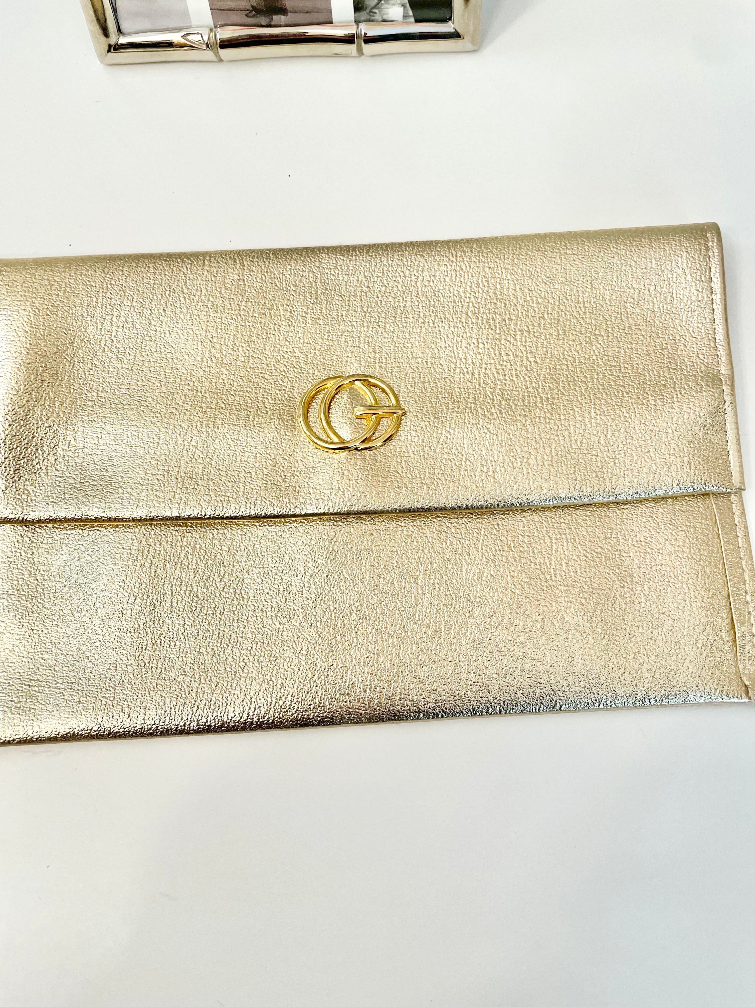 1960's sassy petite gold clutch bag with lovely gold adornment...