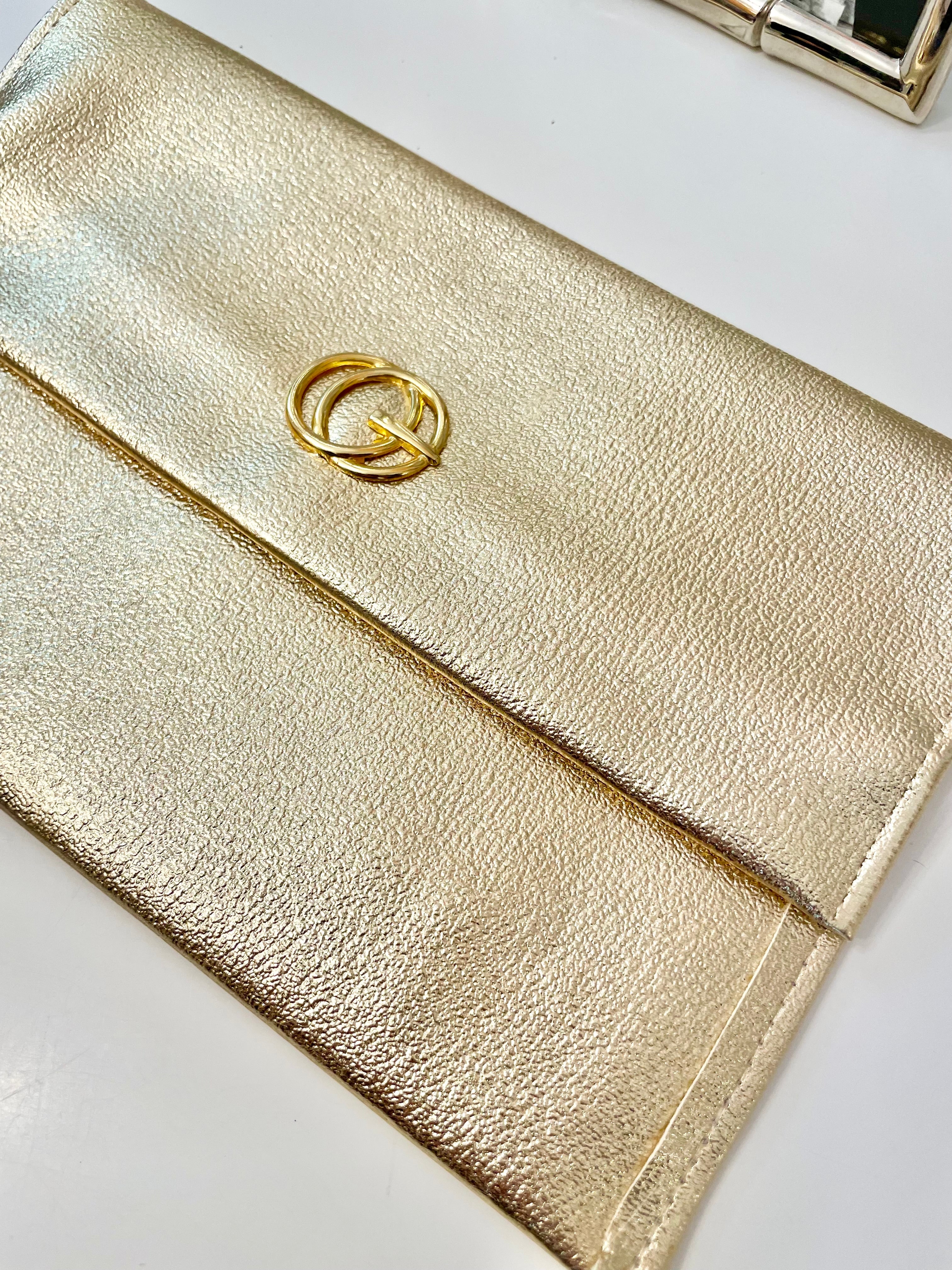 1960's sassy petite gold clutch bag with lovely gold adornment...