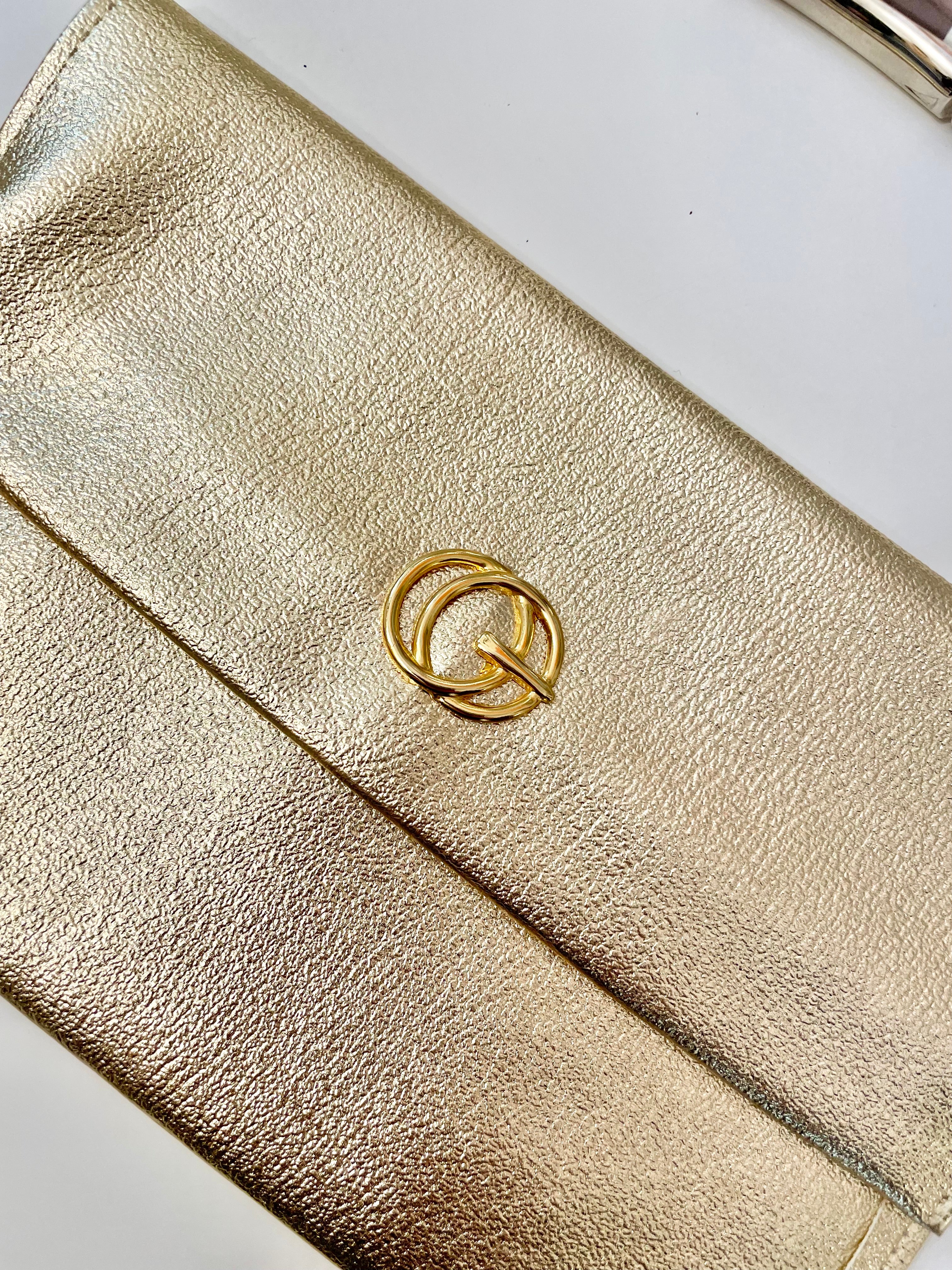 1960's sassy petite gold clutch bag with lovely gold adornment...