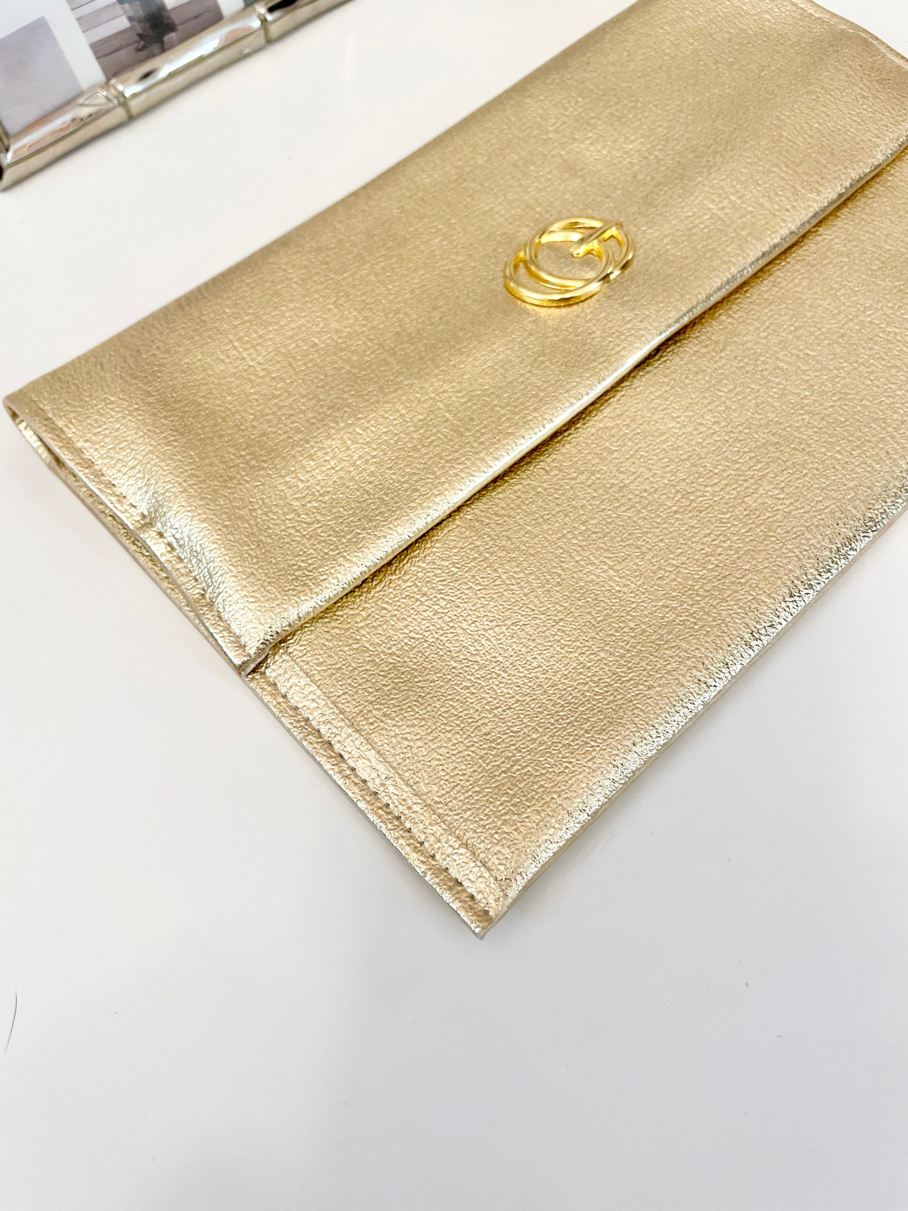 1960's sassy petite gold clutch bag with lovely gold adornment...