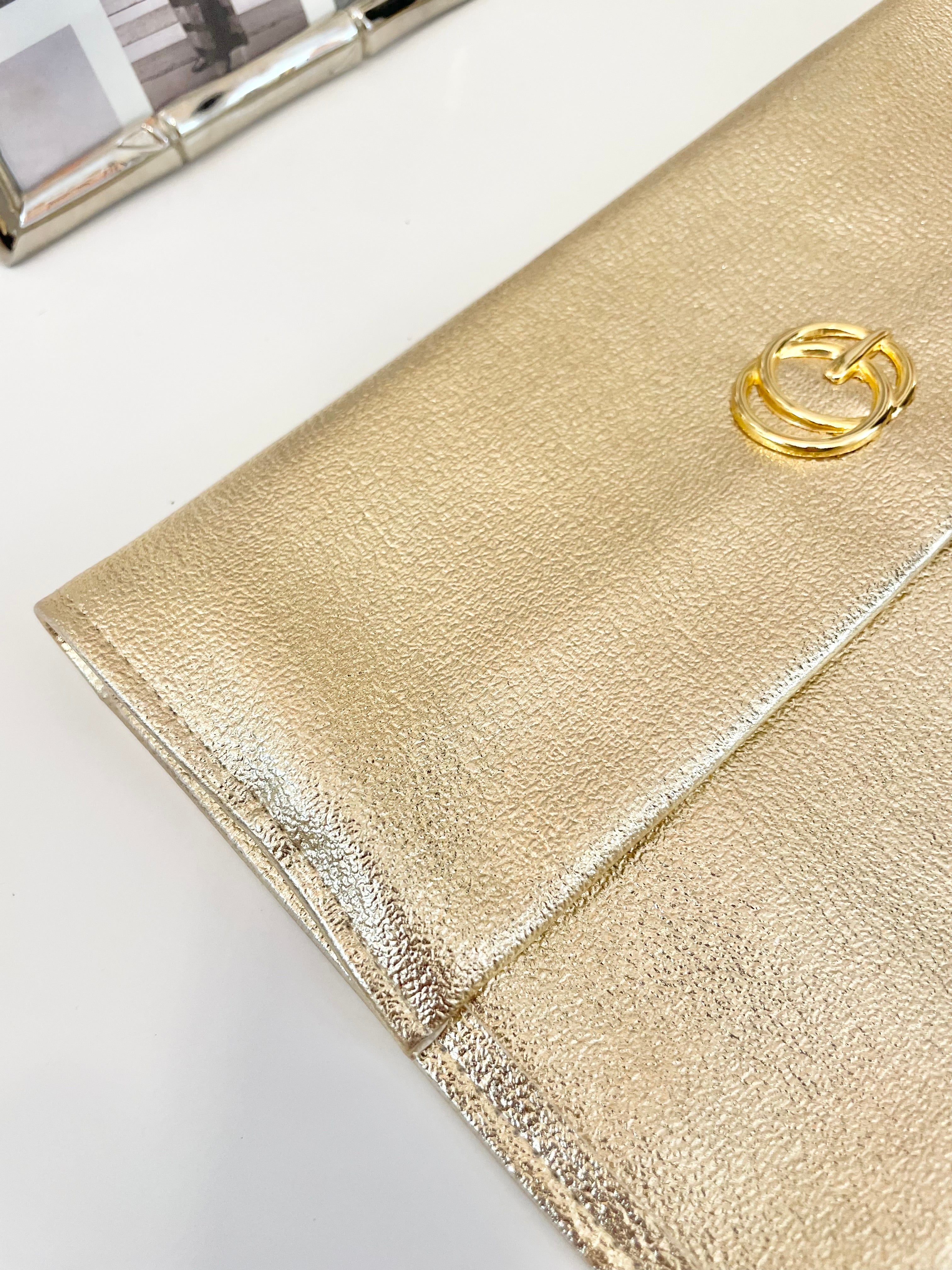 1960's sassy petite gold clutch bag with lovely gold adornment...