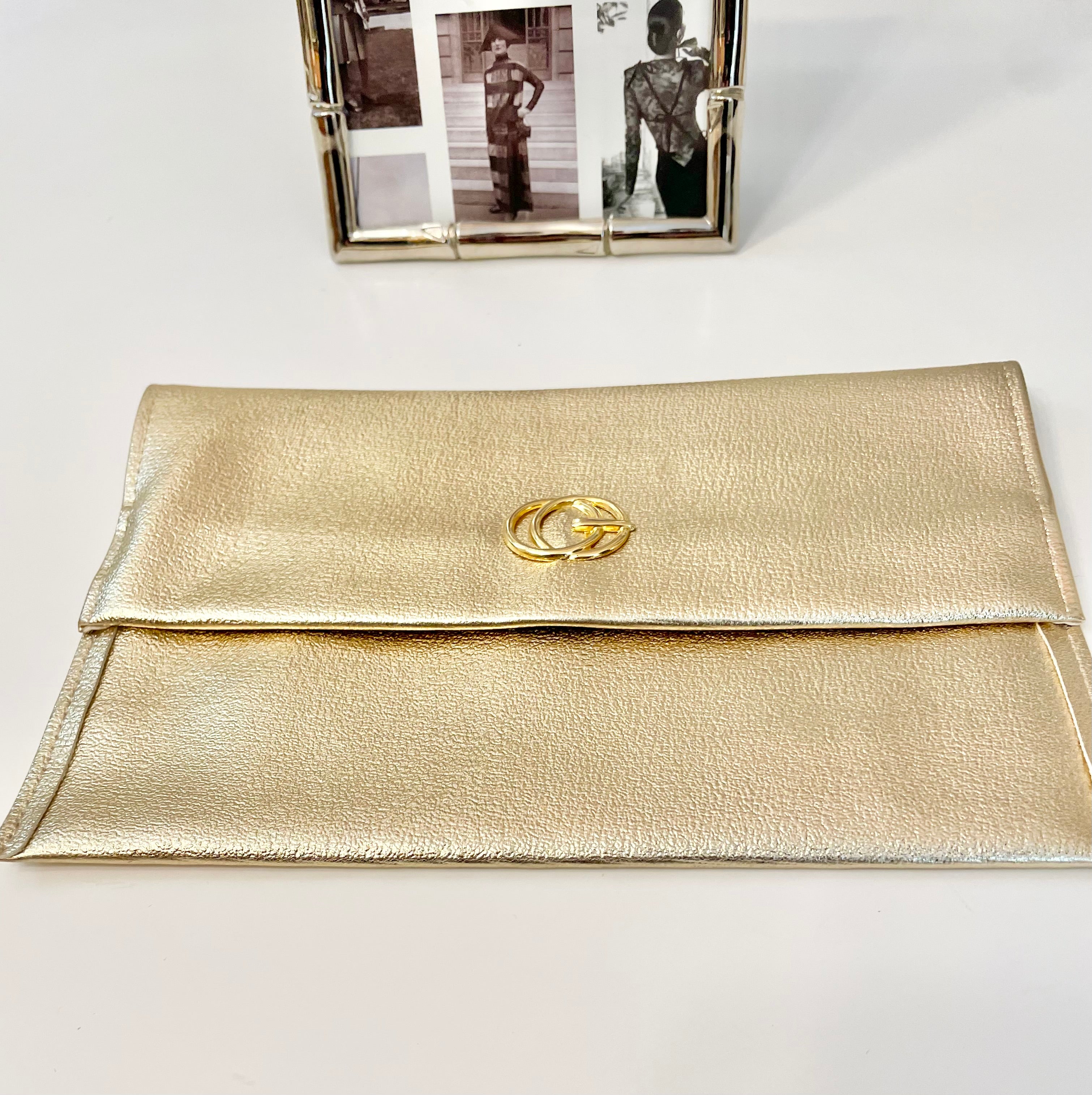 1960's sassy petite gold clutch bag with lovely gold adornment...