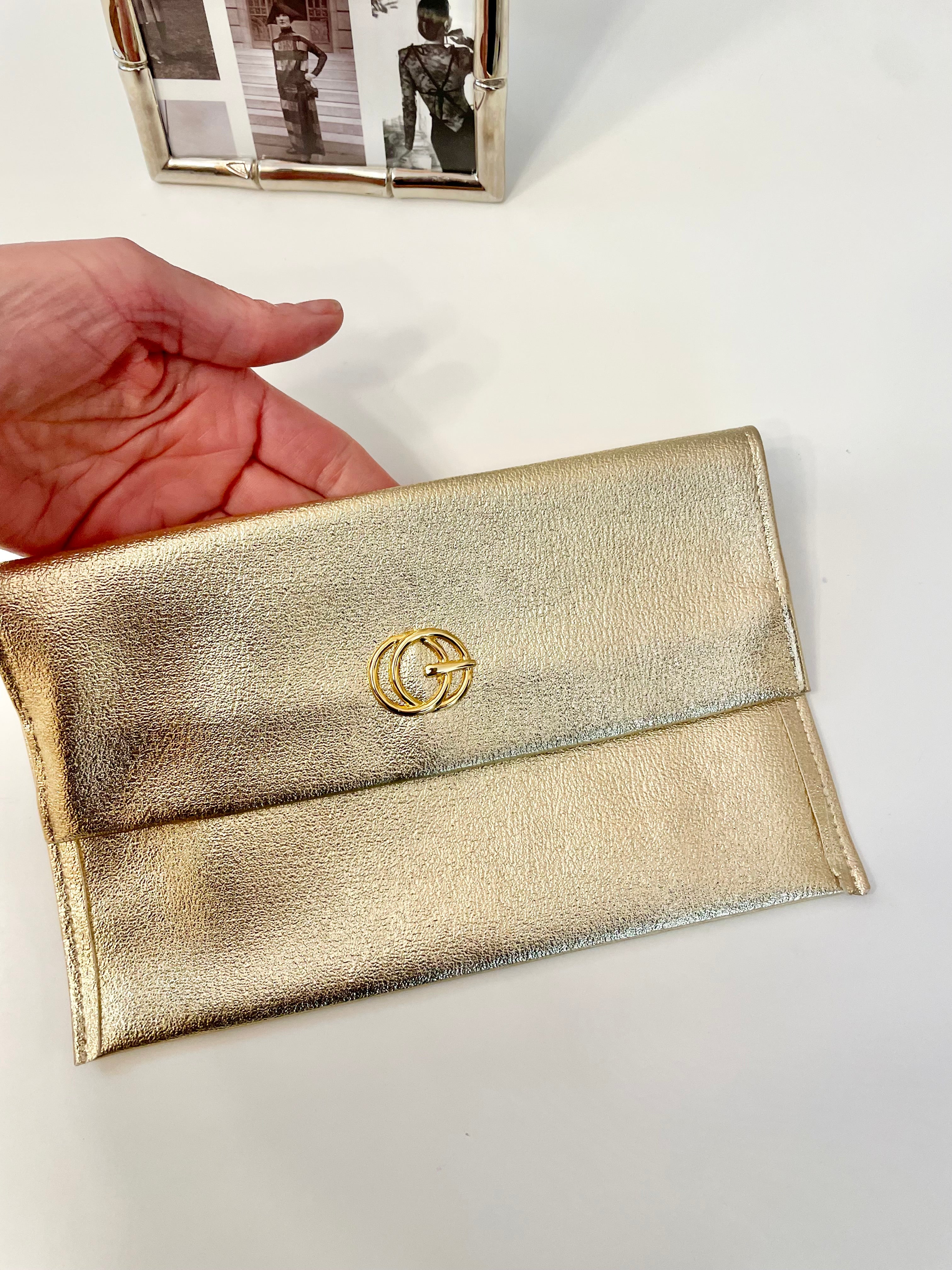 1960's sassy petite gold clutch bag with lovely gold adornment...