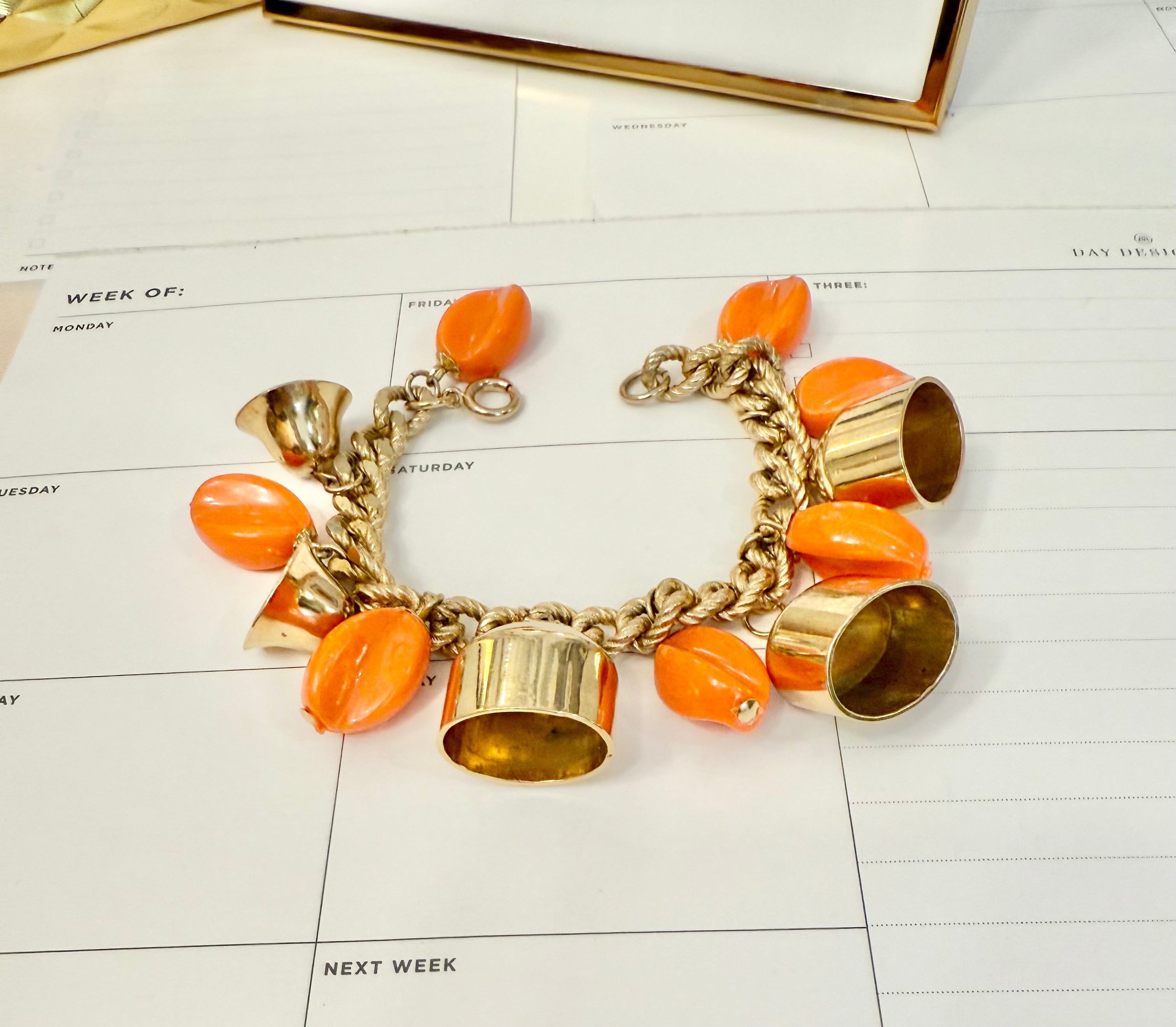 1960's charming gold bell, and orange resin drop bracelet.... so sassy