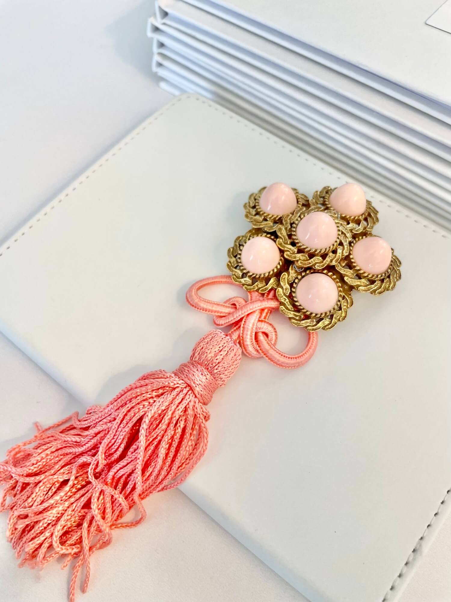 Vintage 1950’s faux angel skin coral flower brooch with a dusting of rhinestones. 2024 So elegant