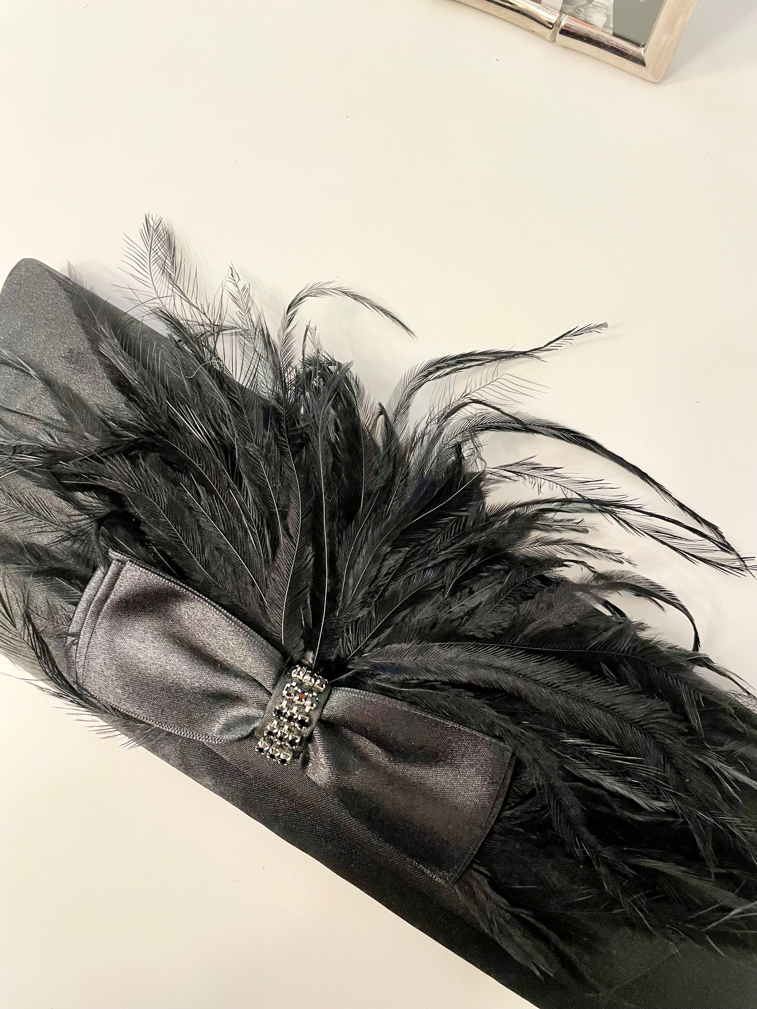 The most lovely noir bow bag with a dusting of feathers....