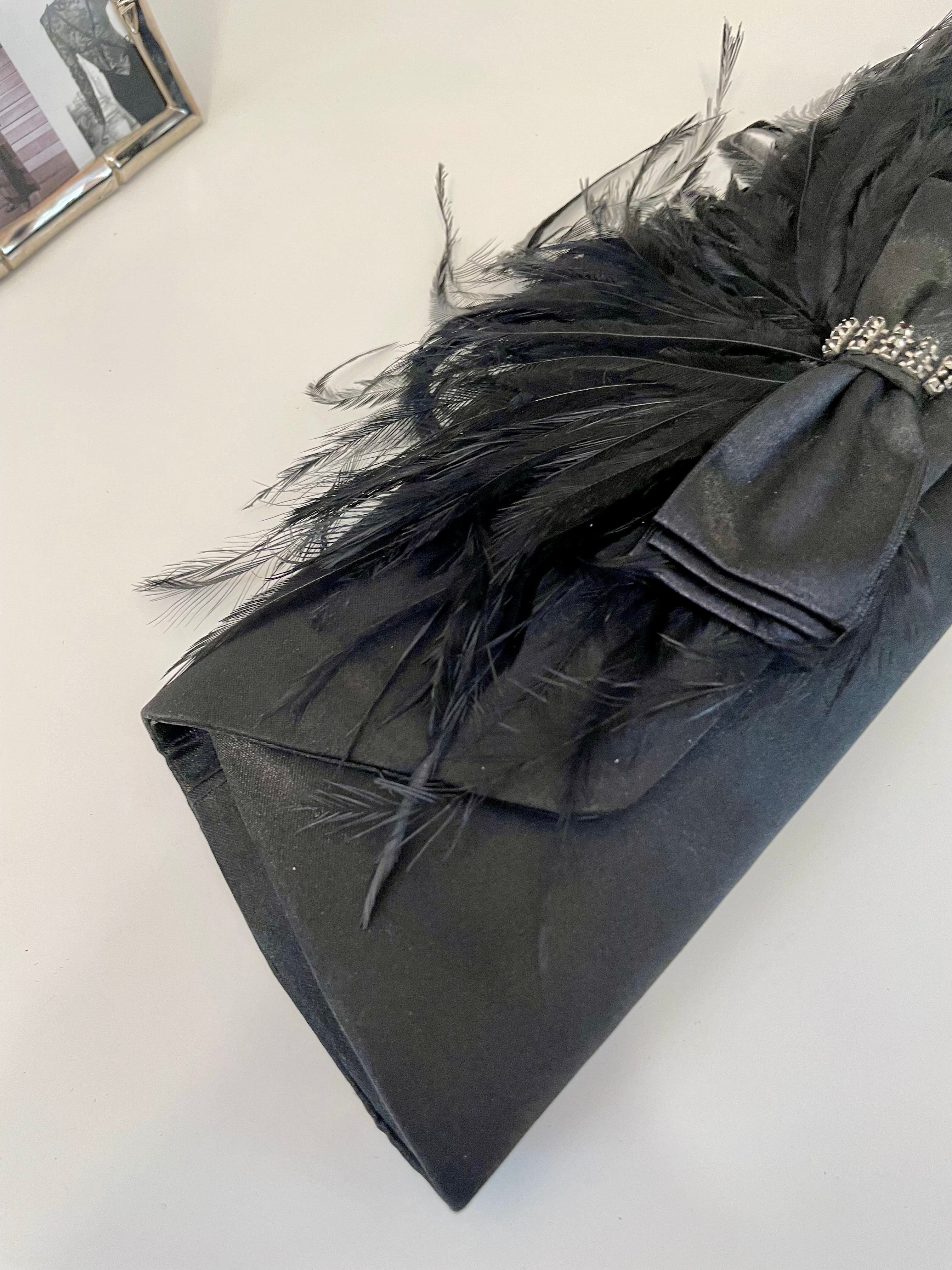 The most lovely noir bow bag with a dusting of feathers....