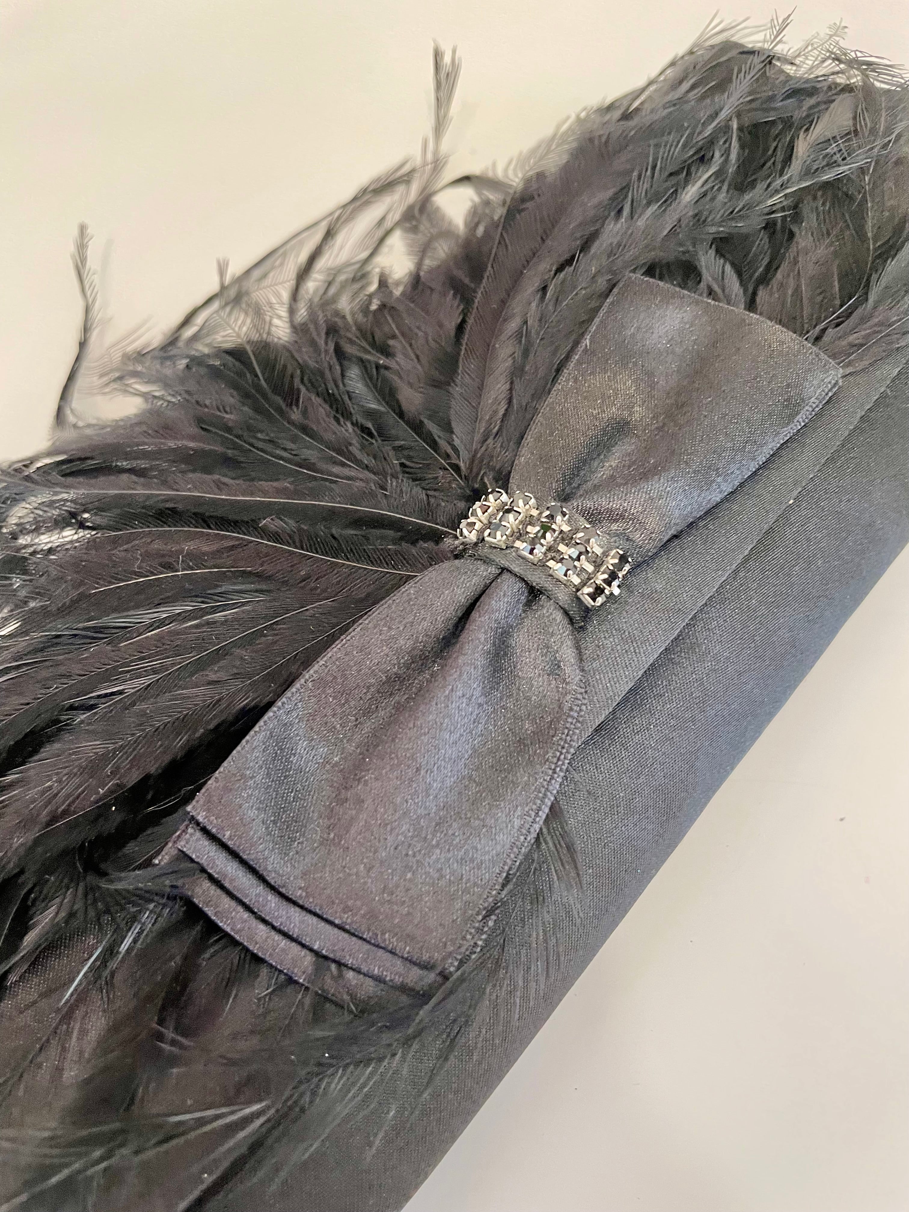 The most lovely noir bow bag with a dusting of feathers....