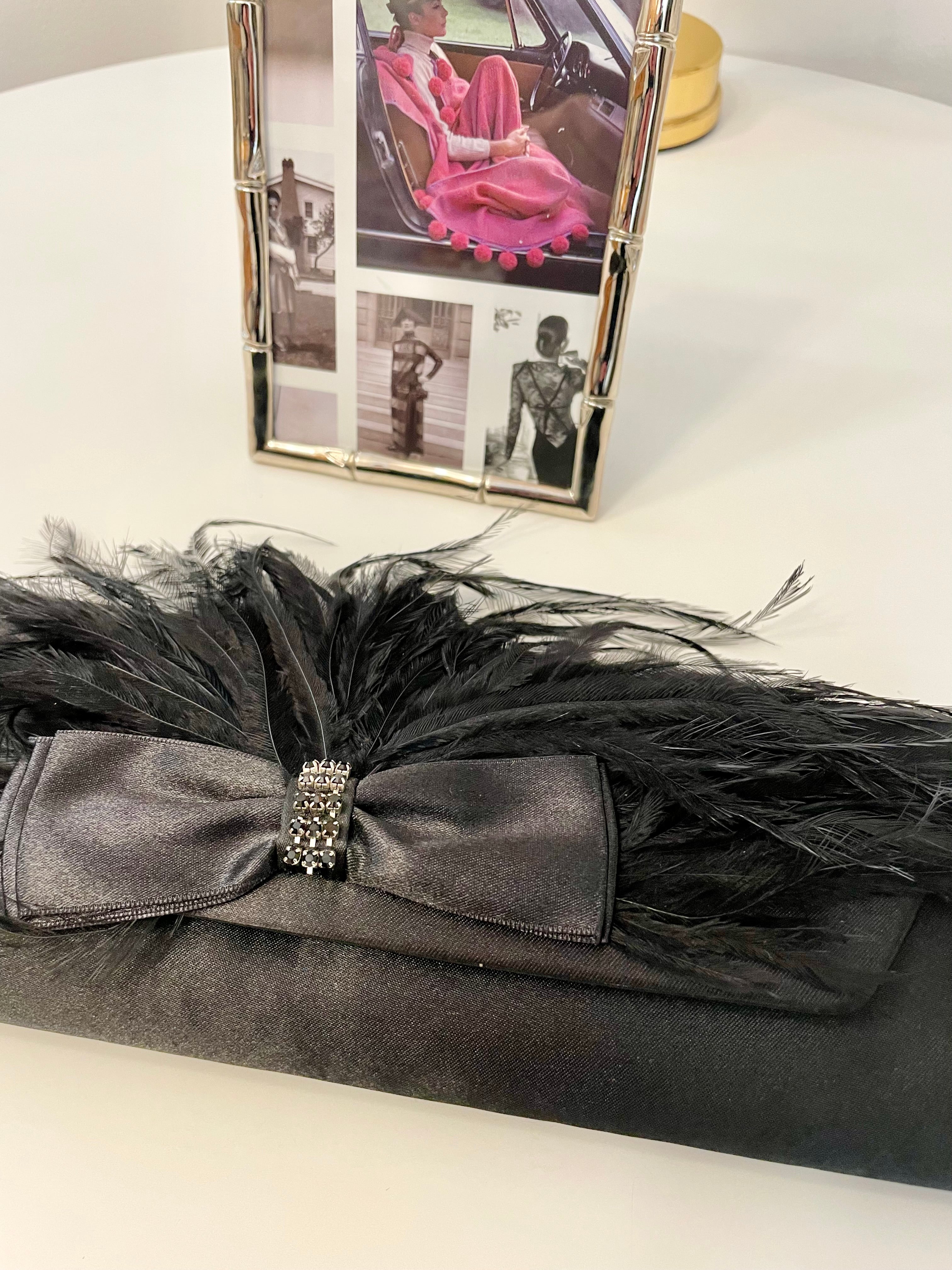 The most lovely noir bow bag with a dusting of feathers....