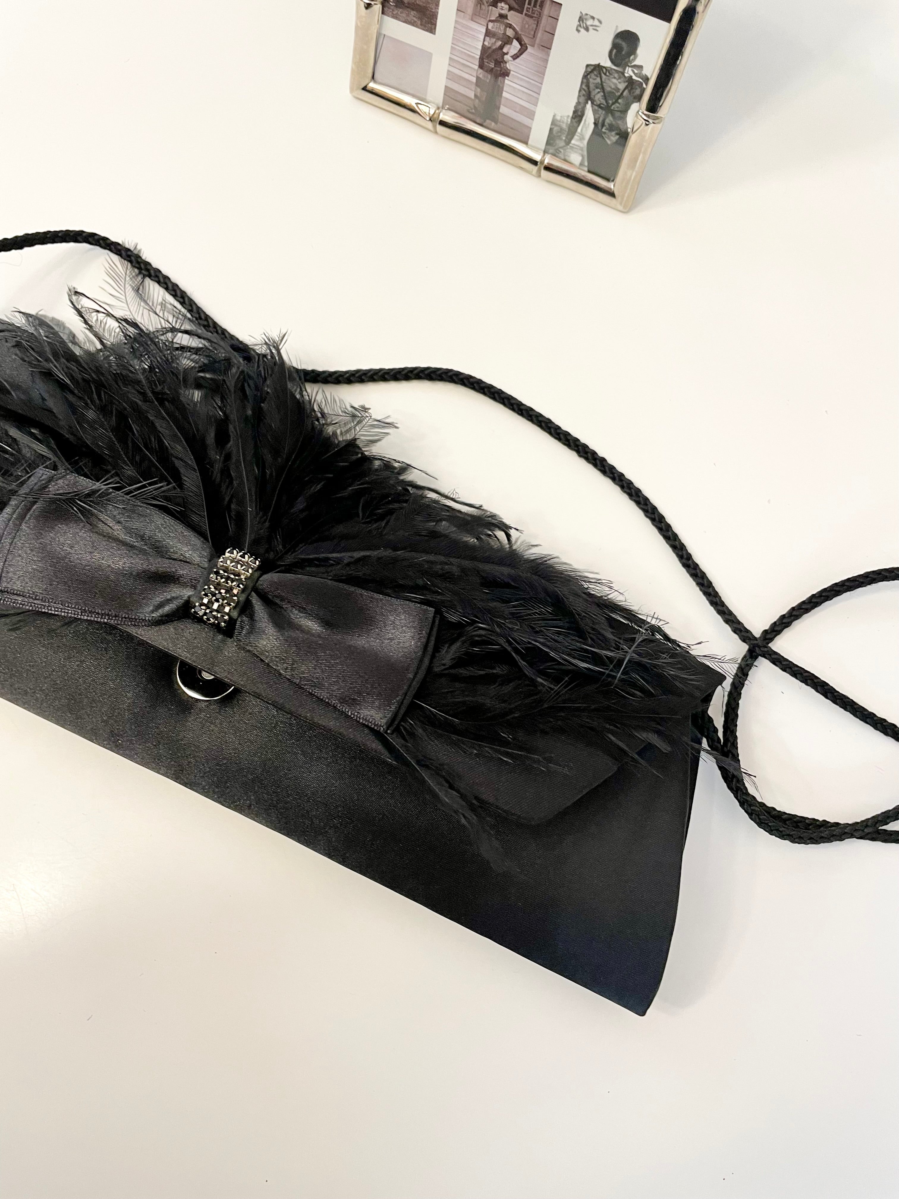 The most lovely noir bow bag with a dusting of feathers....