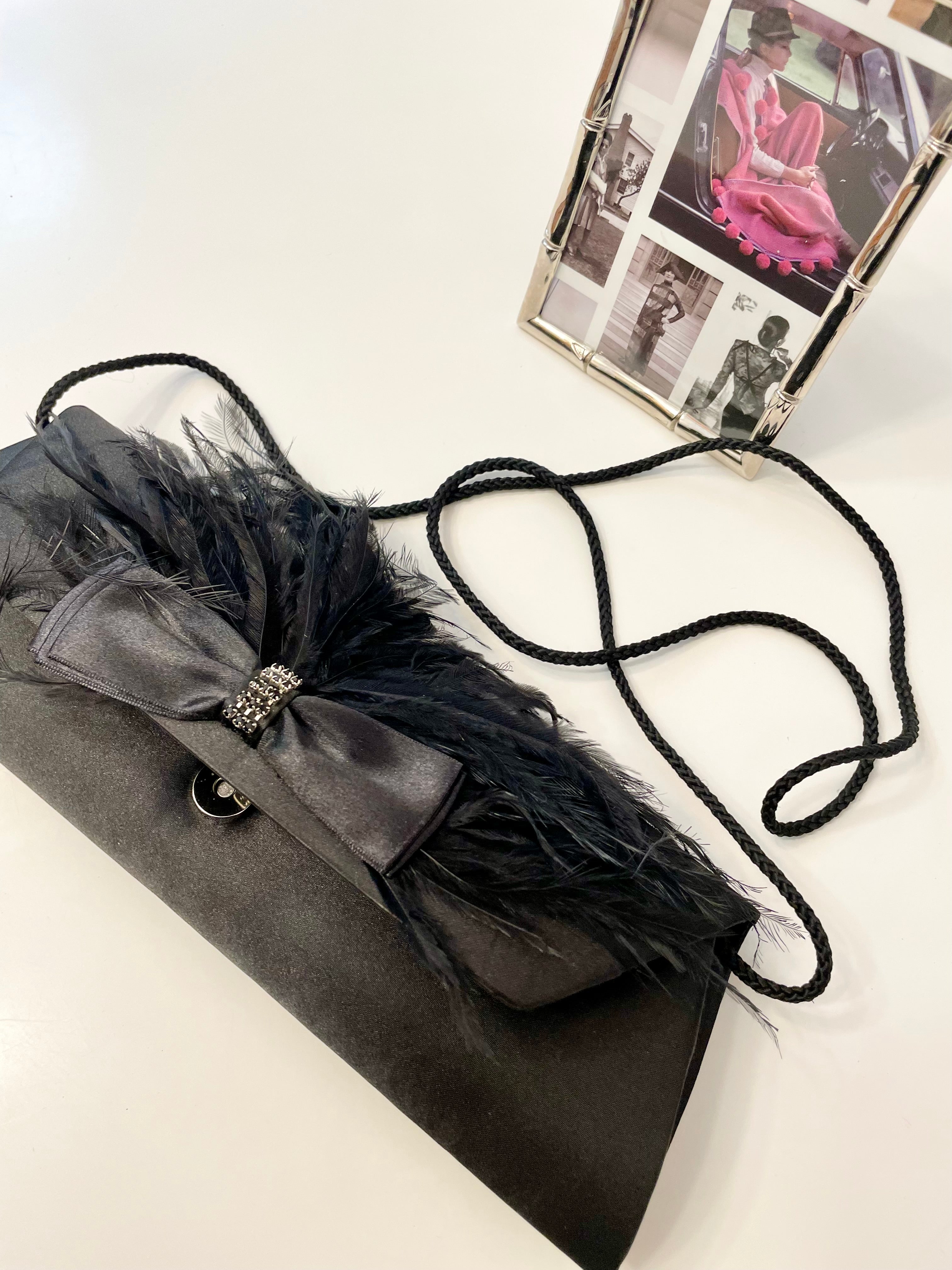 The most lovely noir bow bag with a dusting of feathers....