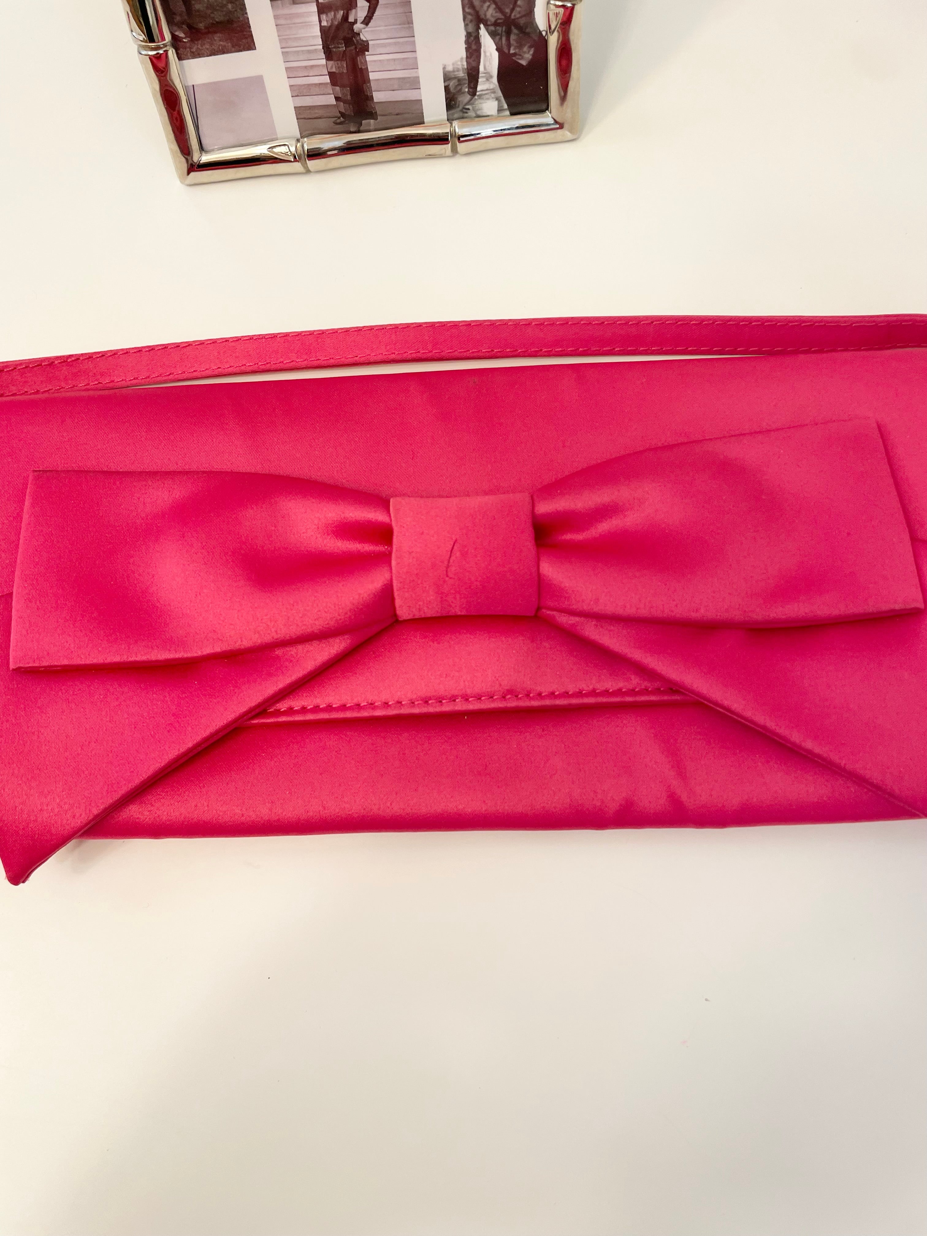 Flirty gal and her love of a classy pink bow bag!