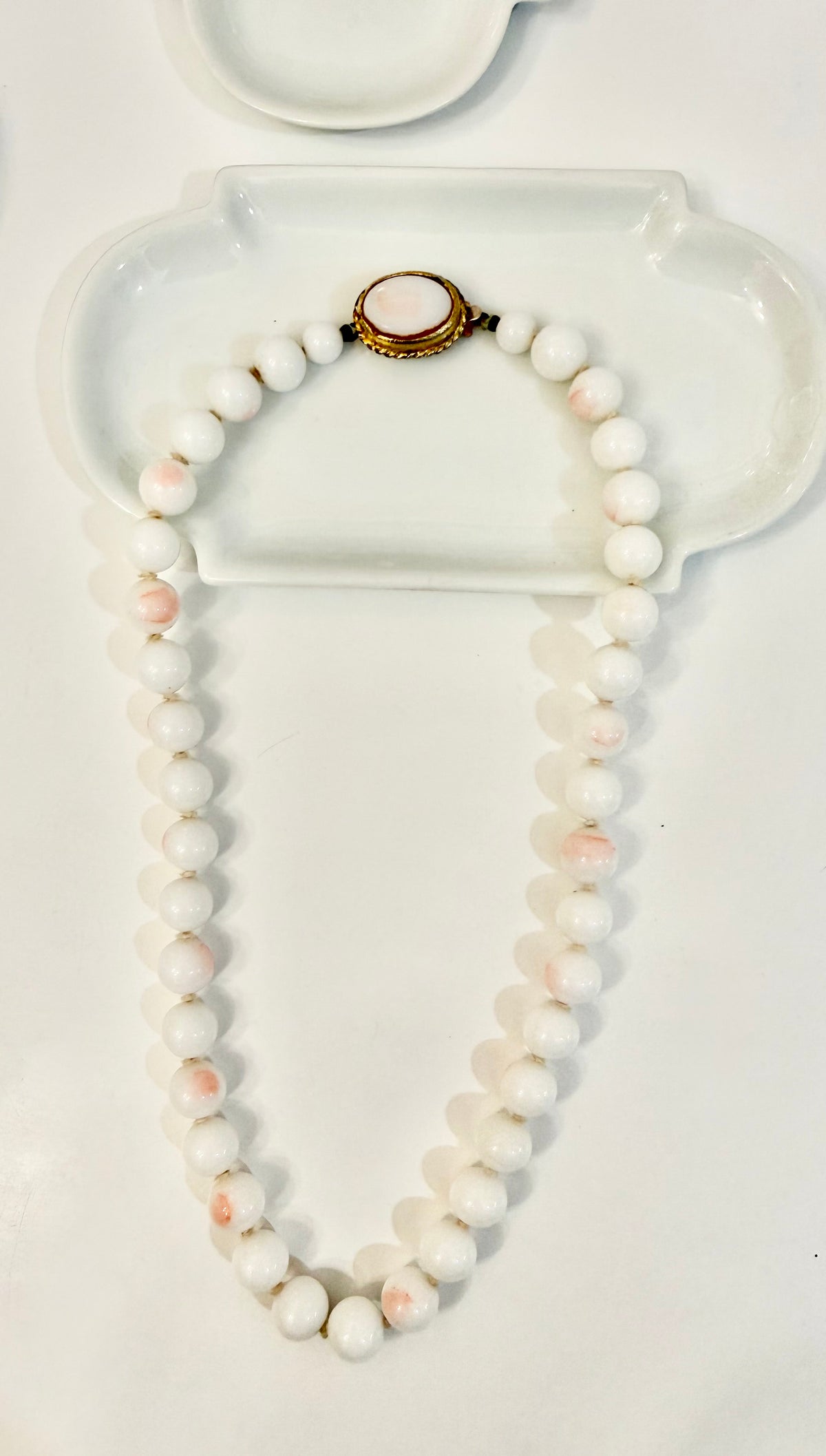 The most elegant faux angel skin coral glass necklace... so feminine