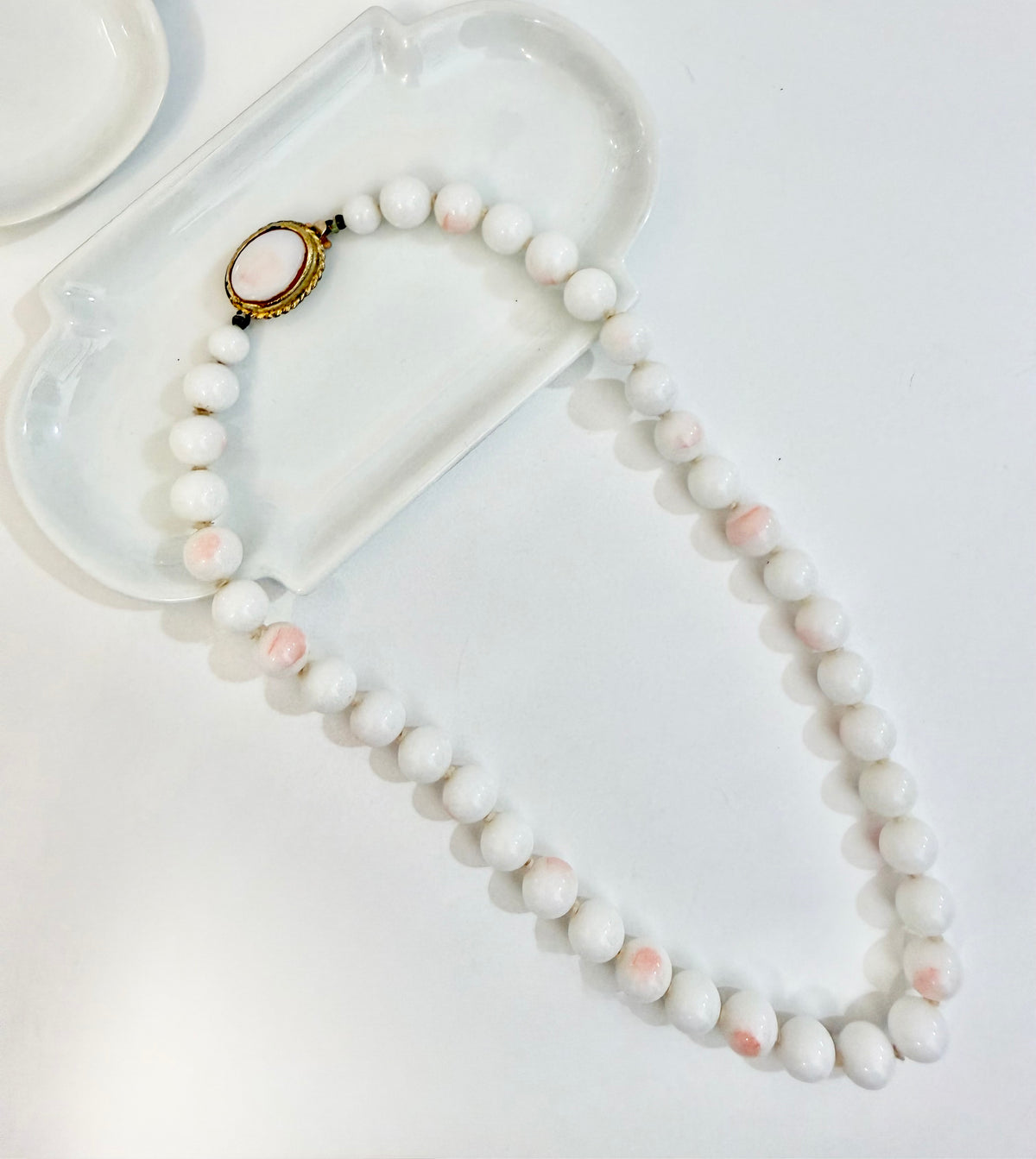 The most elegant faux angel skin coral glass necklace... so feminine
