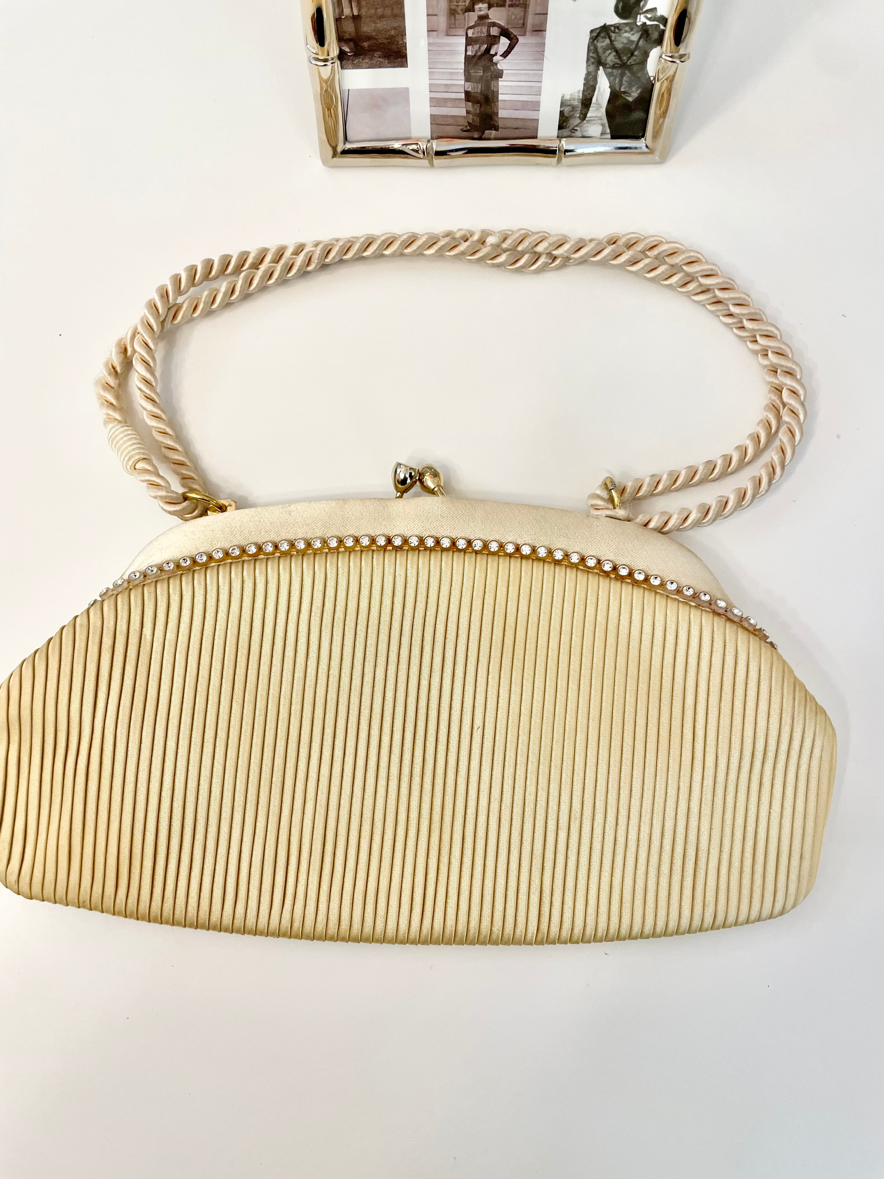 The most lovely ivory satin pleated evening bag.... so chic