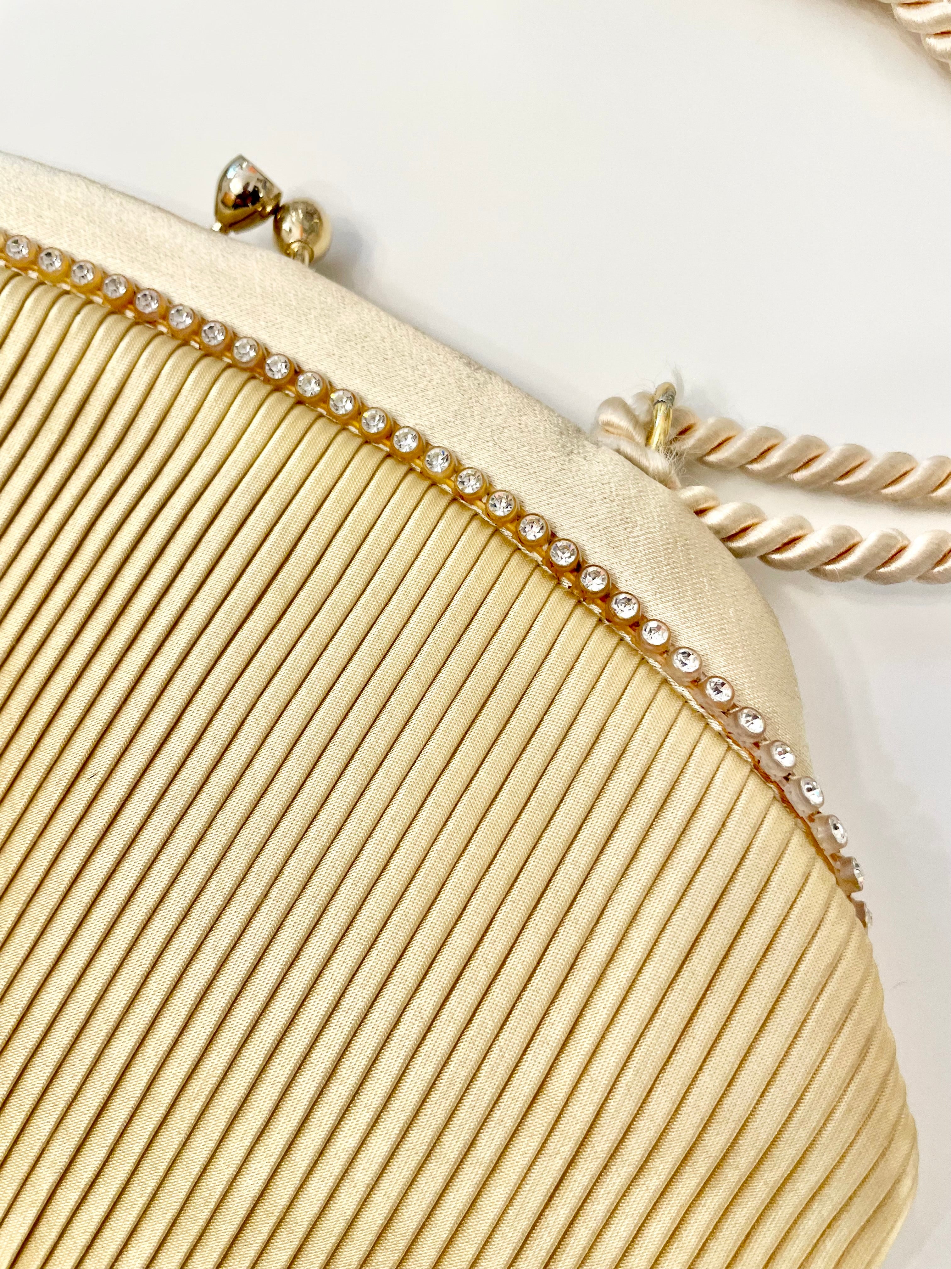 The most lovely ivory satin pleated evening bag.... so chic