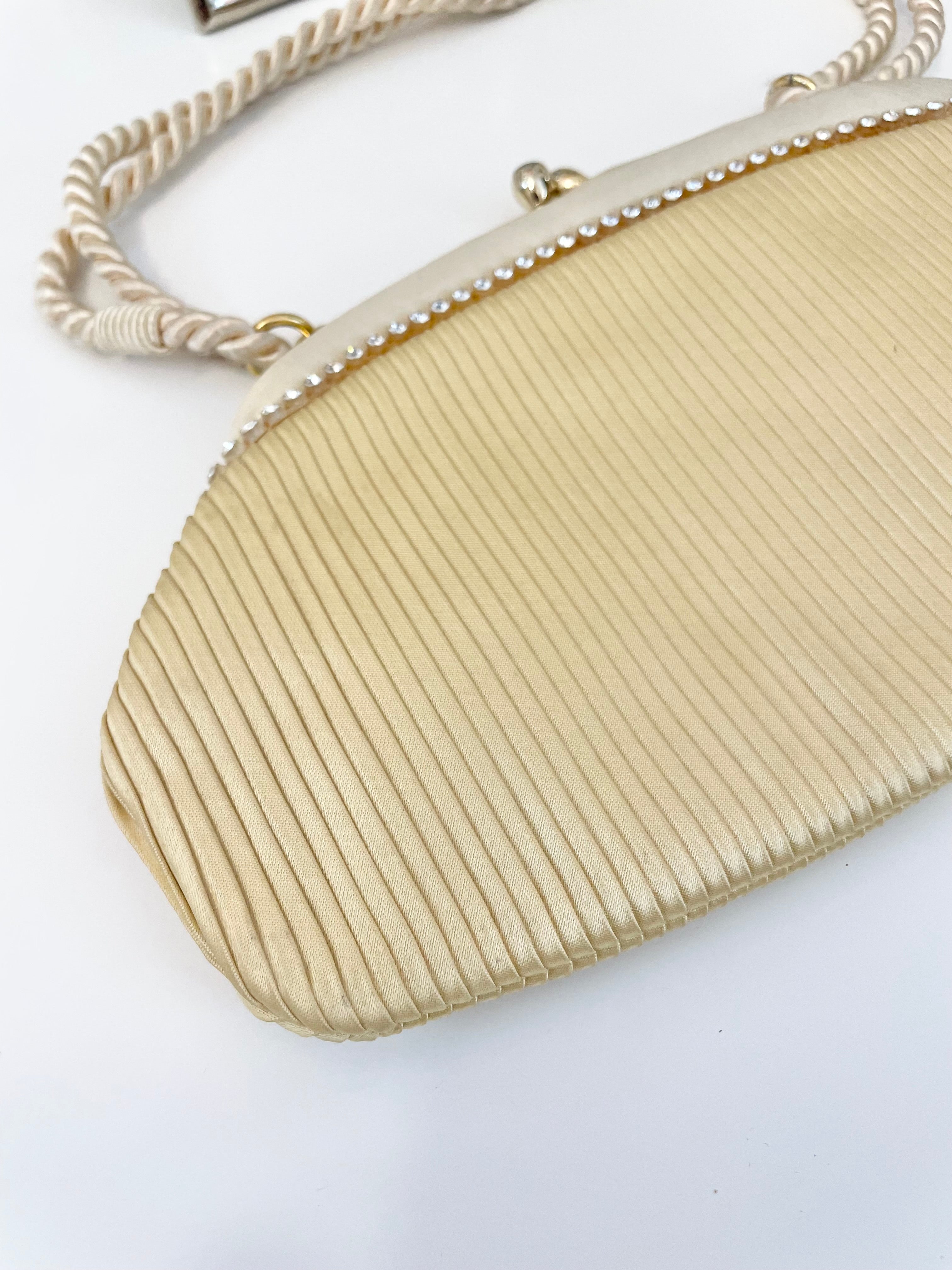 The most lovely ivory satin pleated evening bag.... so chic