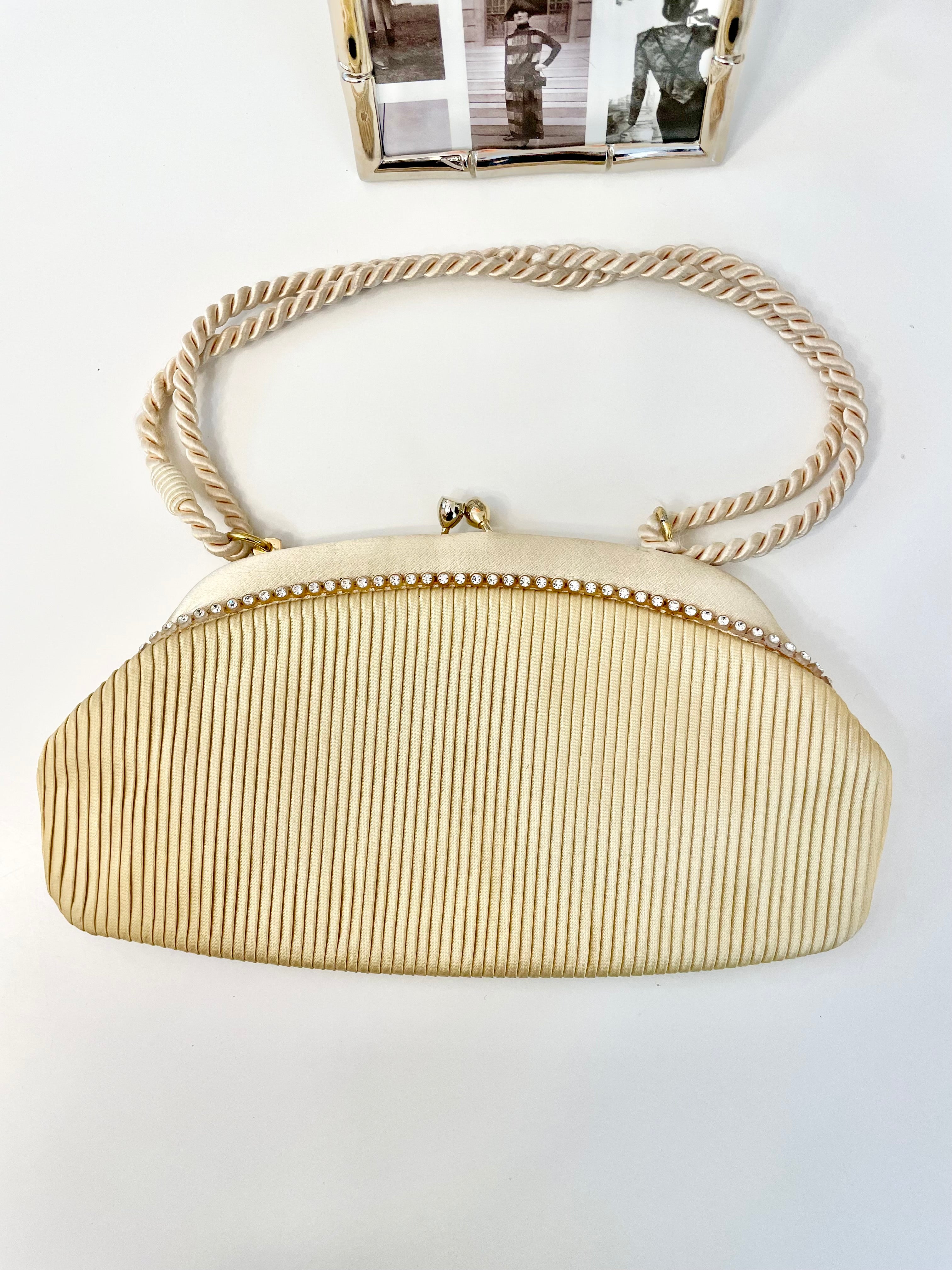 The most lovely ivory satin pleated evening bag.... so chic