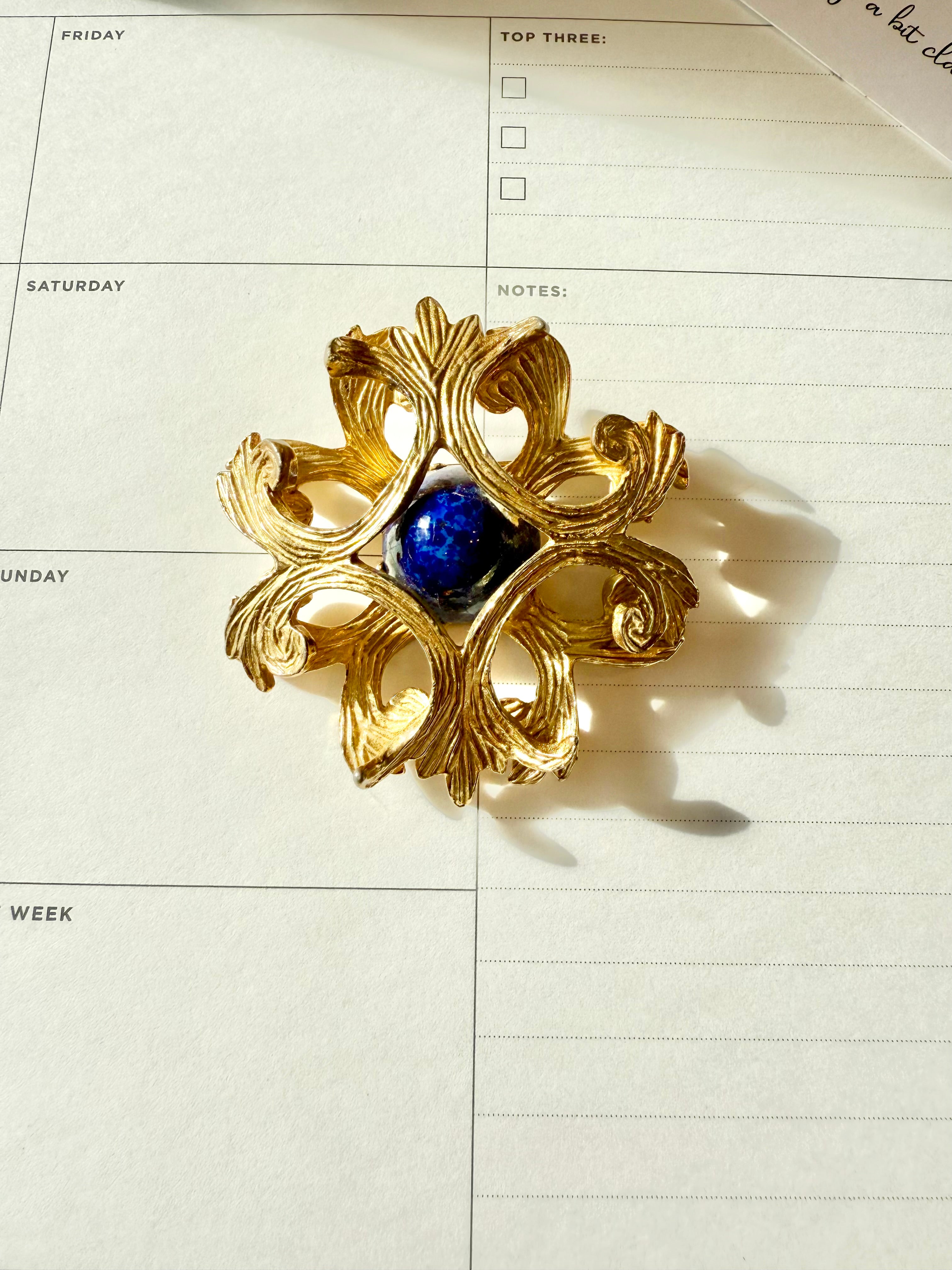 Regal, and classy Faux lapis Maltese cross brooch.... timeless