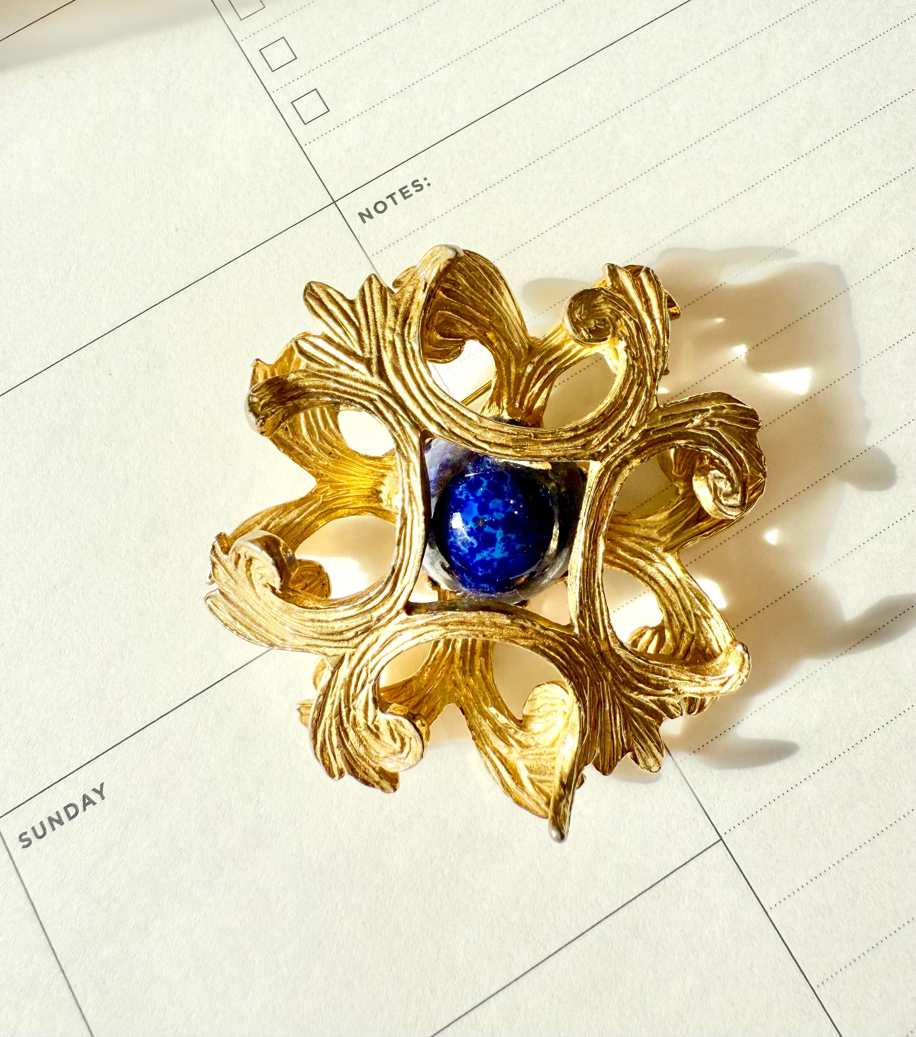 Regal, and classy Faux lapis Maltese cross brooch.... timeless