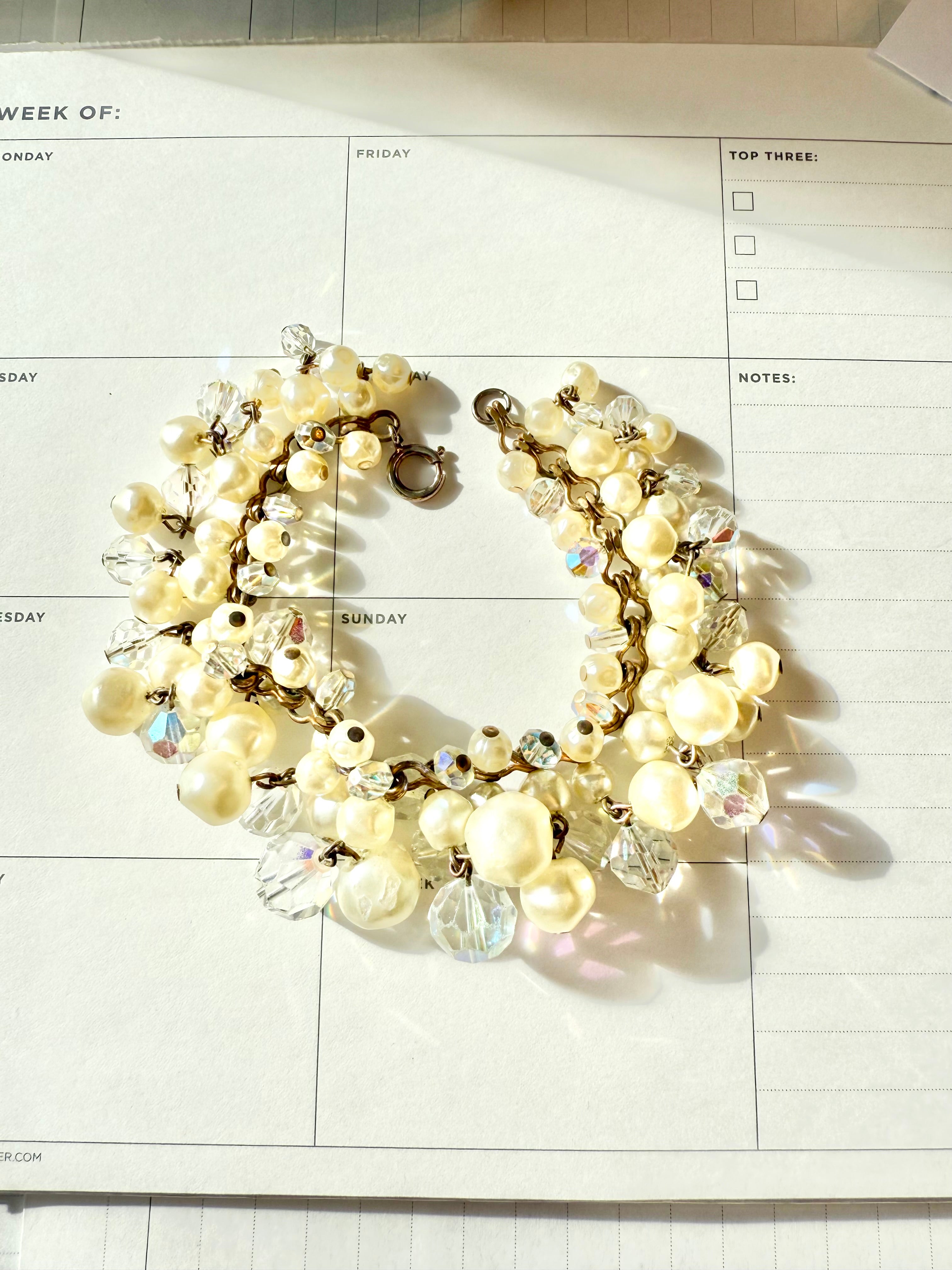 The most darling pearl, and glass charm bracelet... so chic