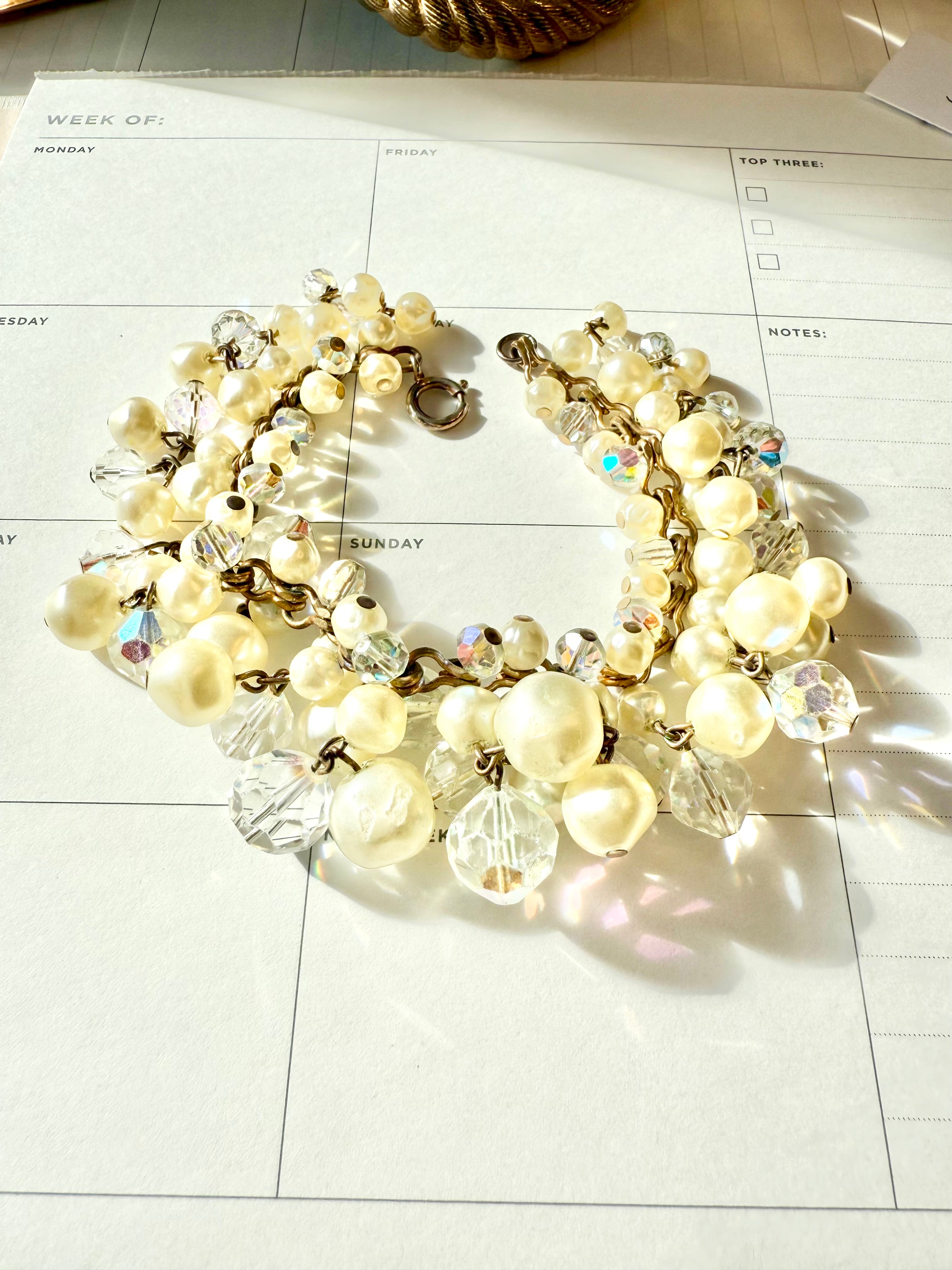 The most darling pearl, and glass charm bracelet... so chic