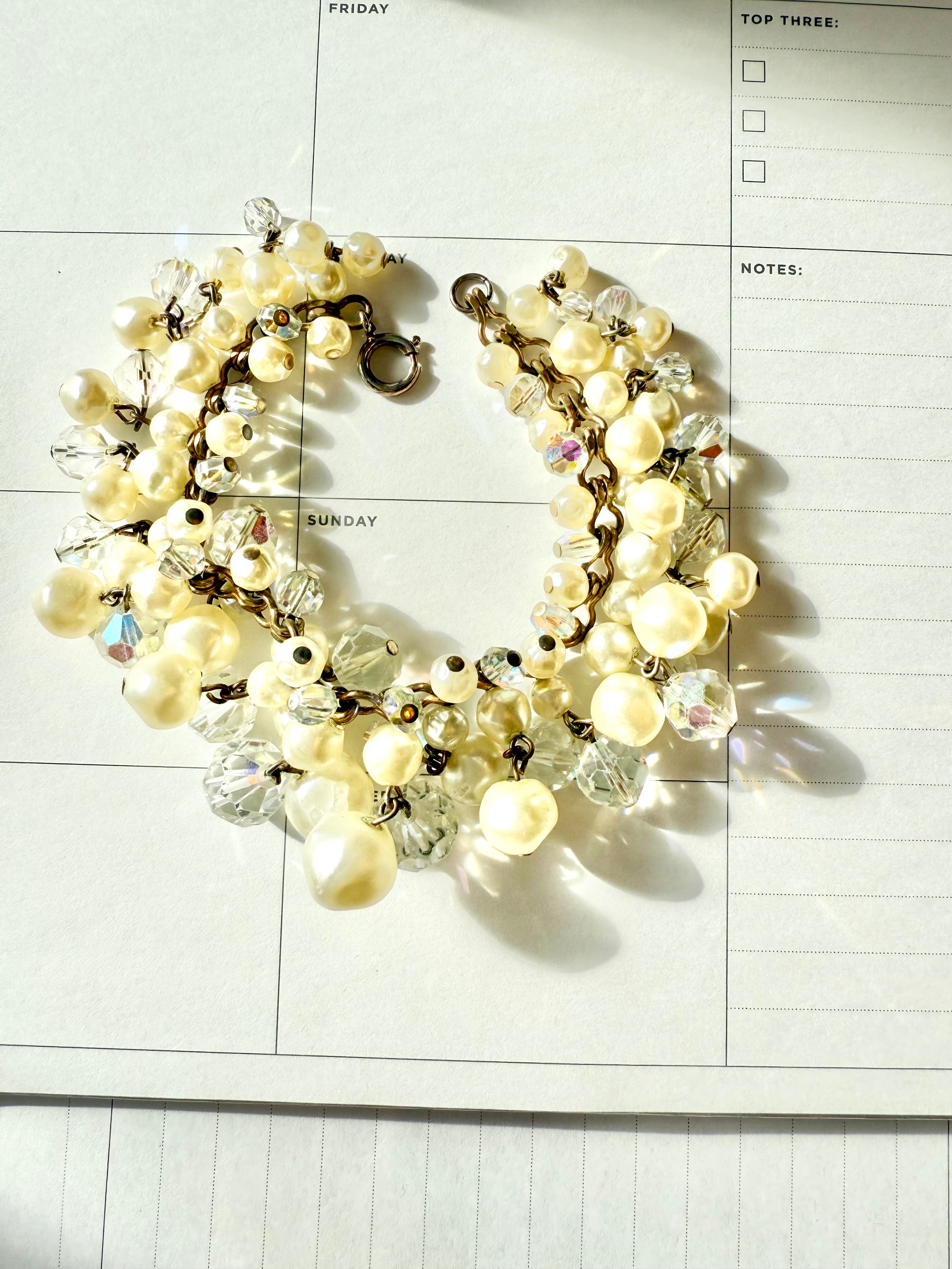 The most darling pearl, and glass charm bracelet... so chic