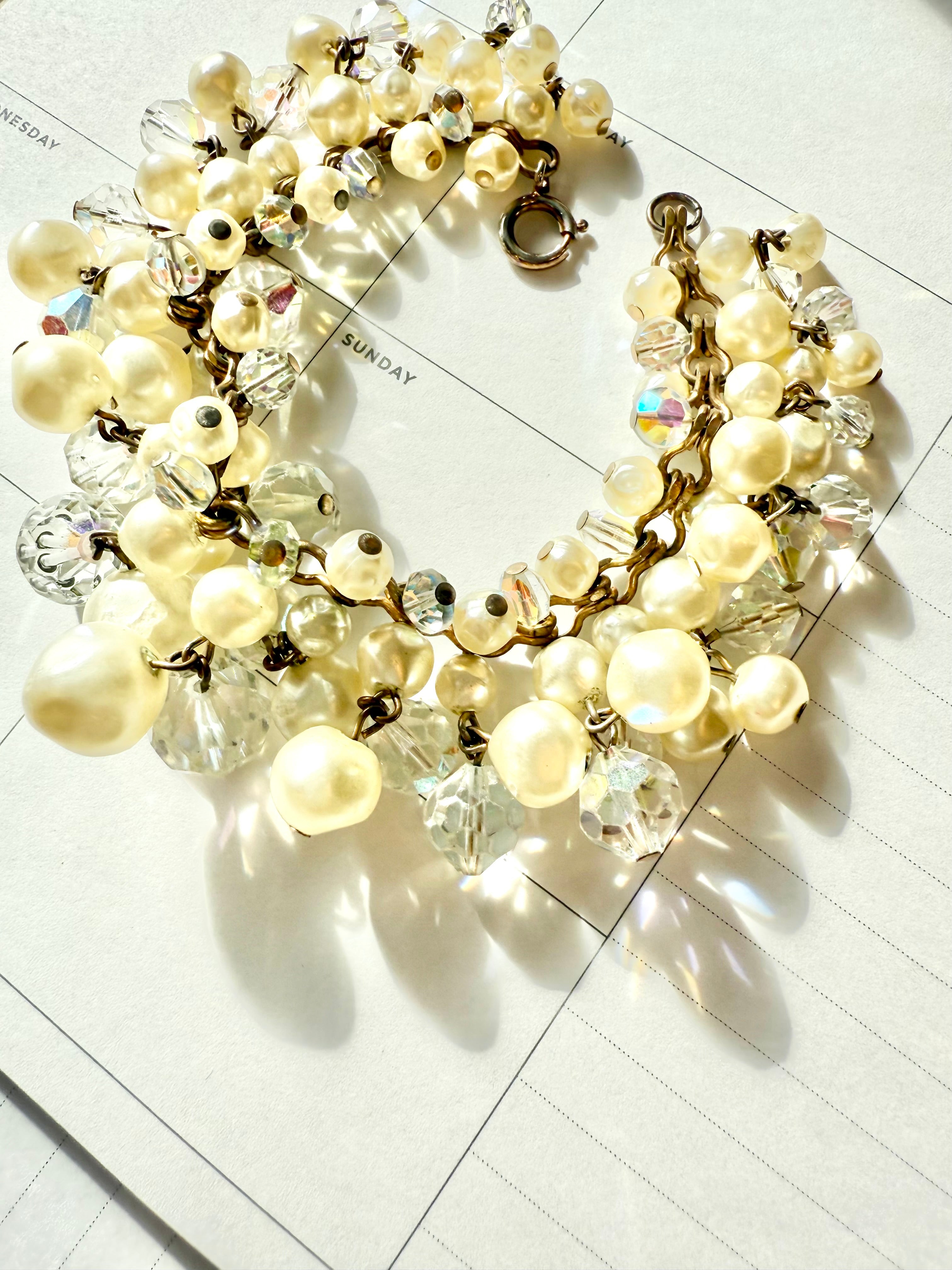 The most darling pearl, and glass charm bracelet... so chic