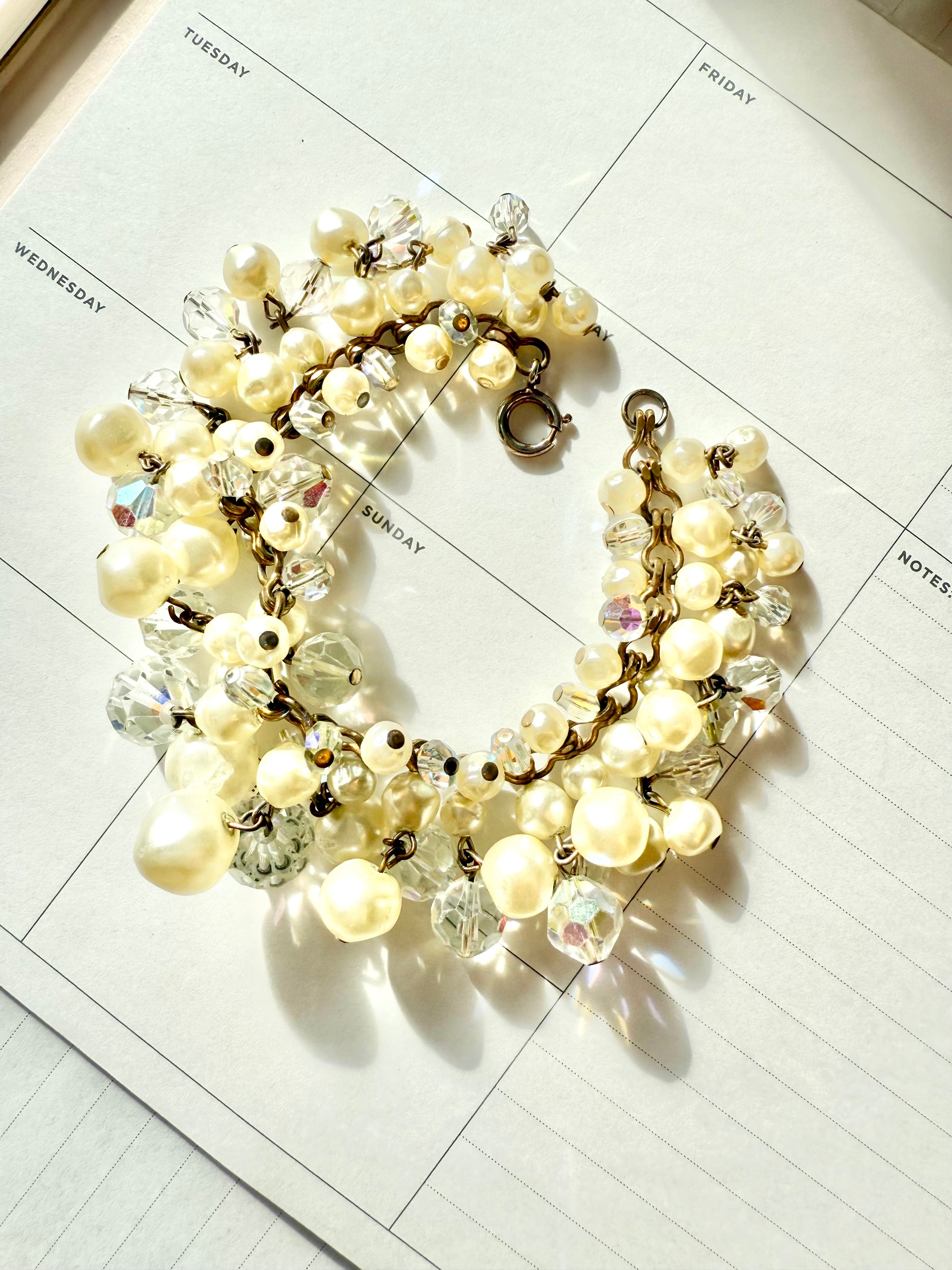 The most darling pearl, and glass charm bracelet... so chic