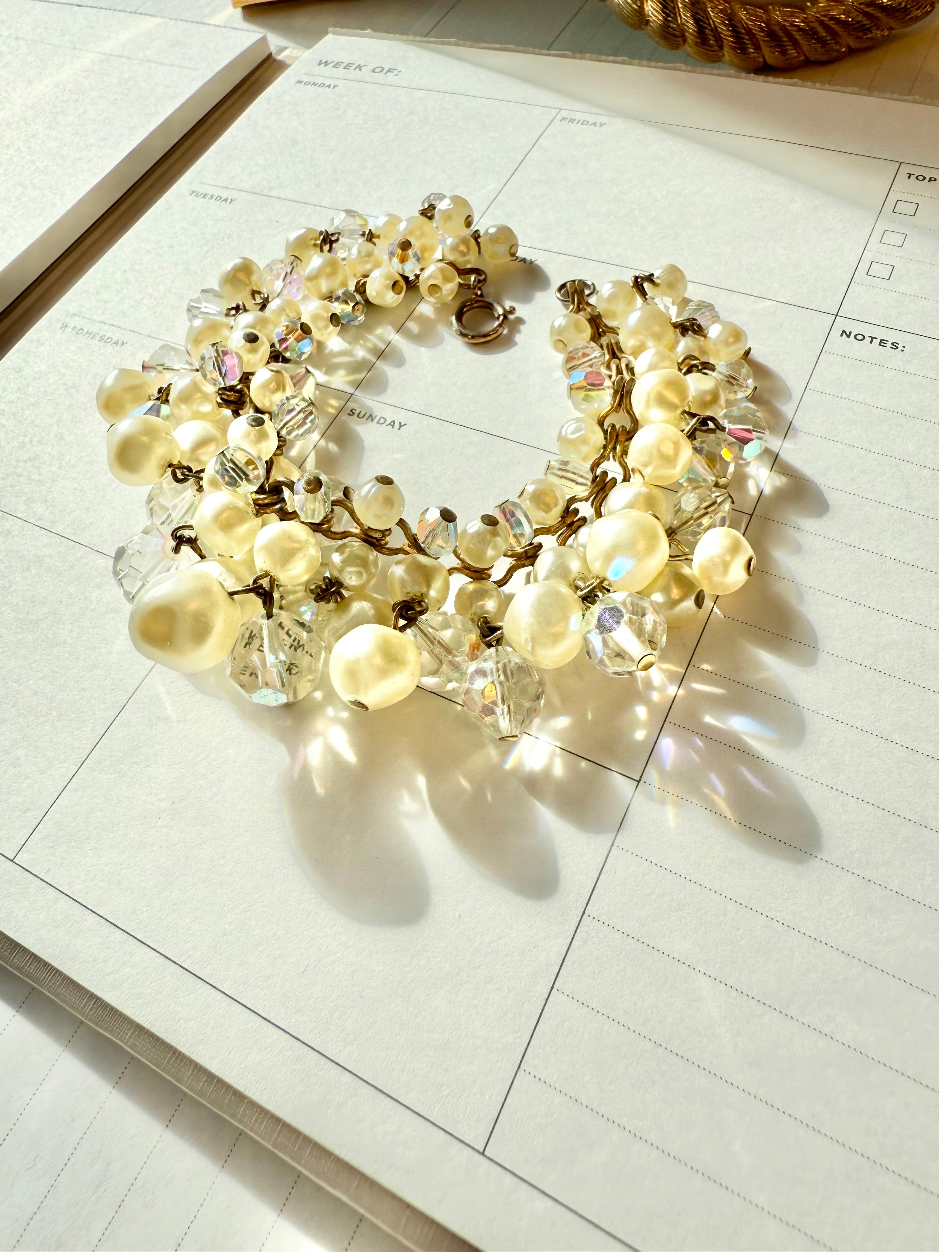 The most darling pearl, and glass charm bracelet... so chic