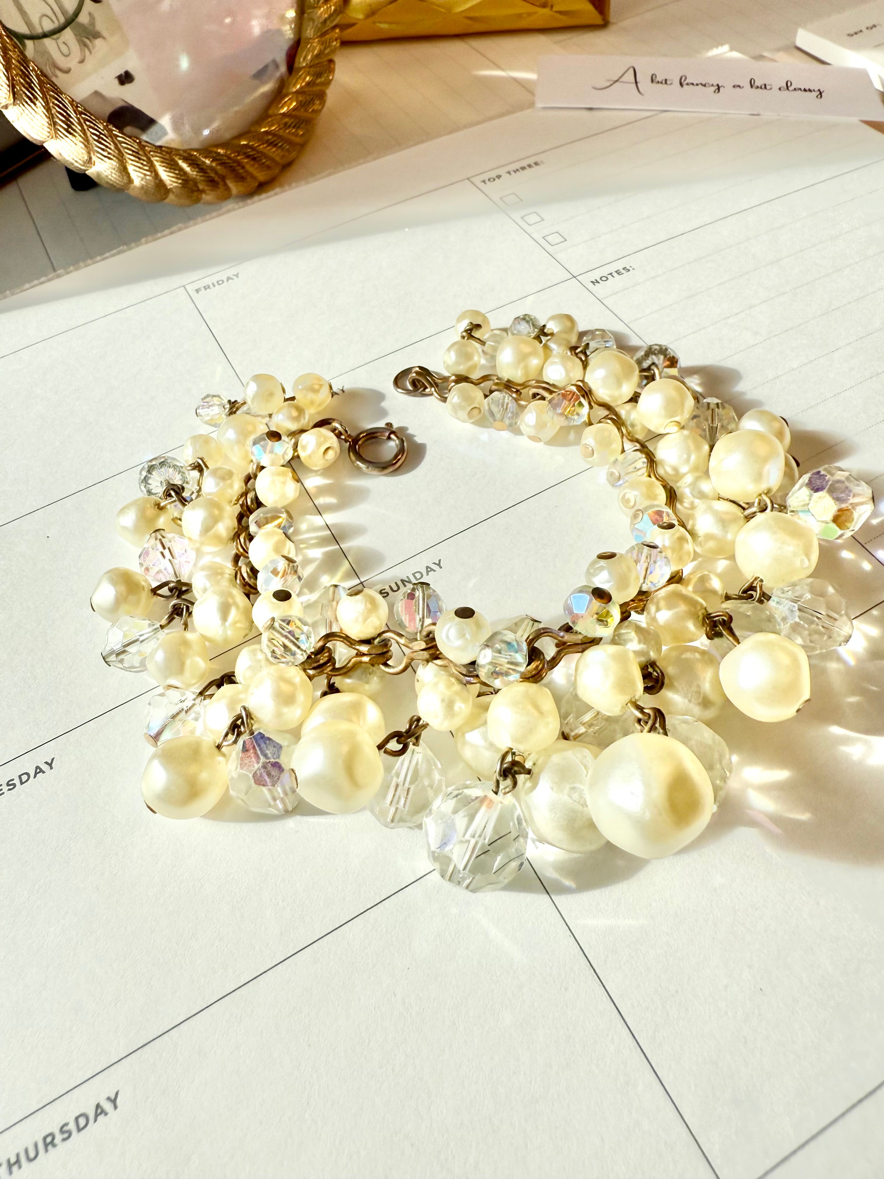 The most darling pearl, and glass charm bracelet... so chic