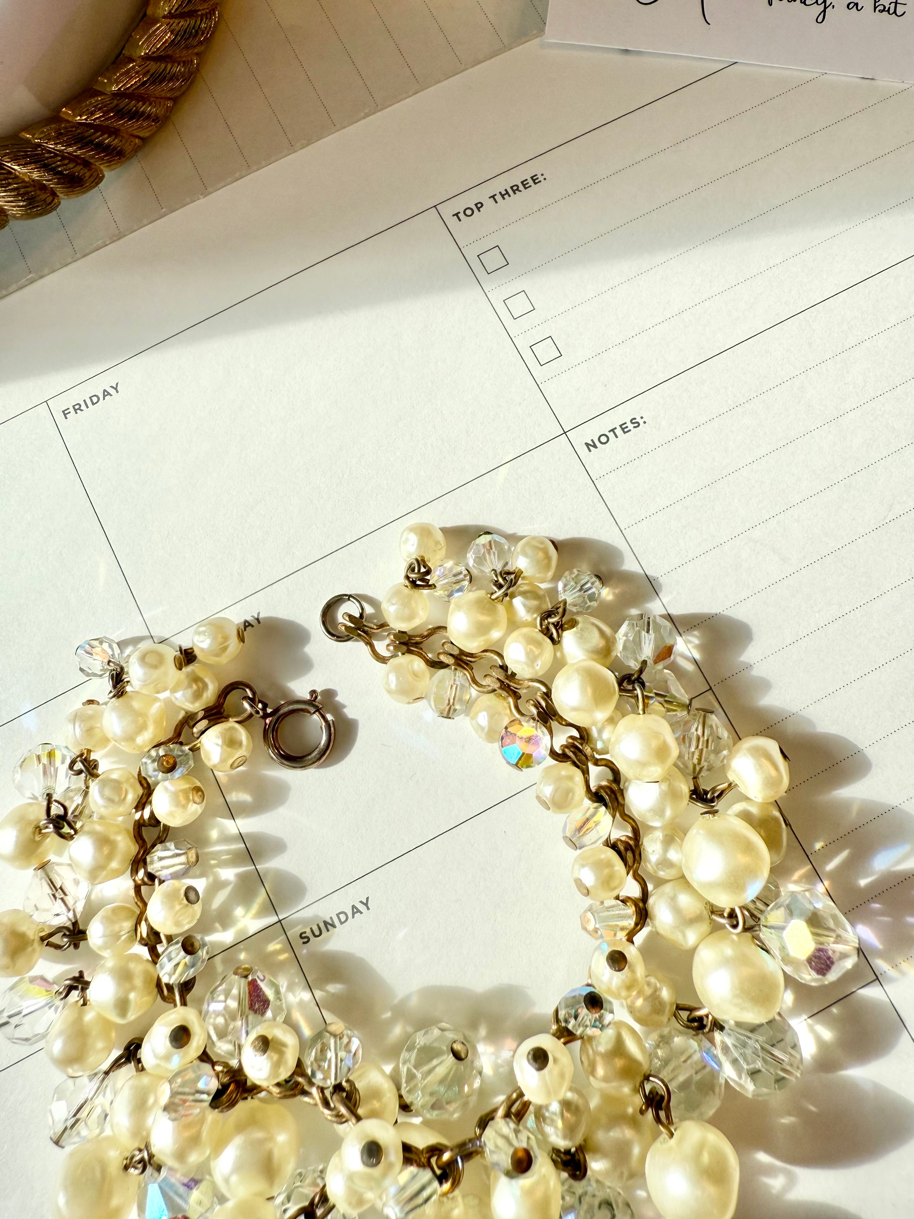 The most darling pearl, and glass charm bracelet... so chic