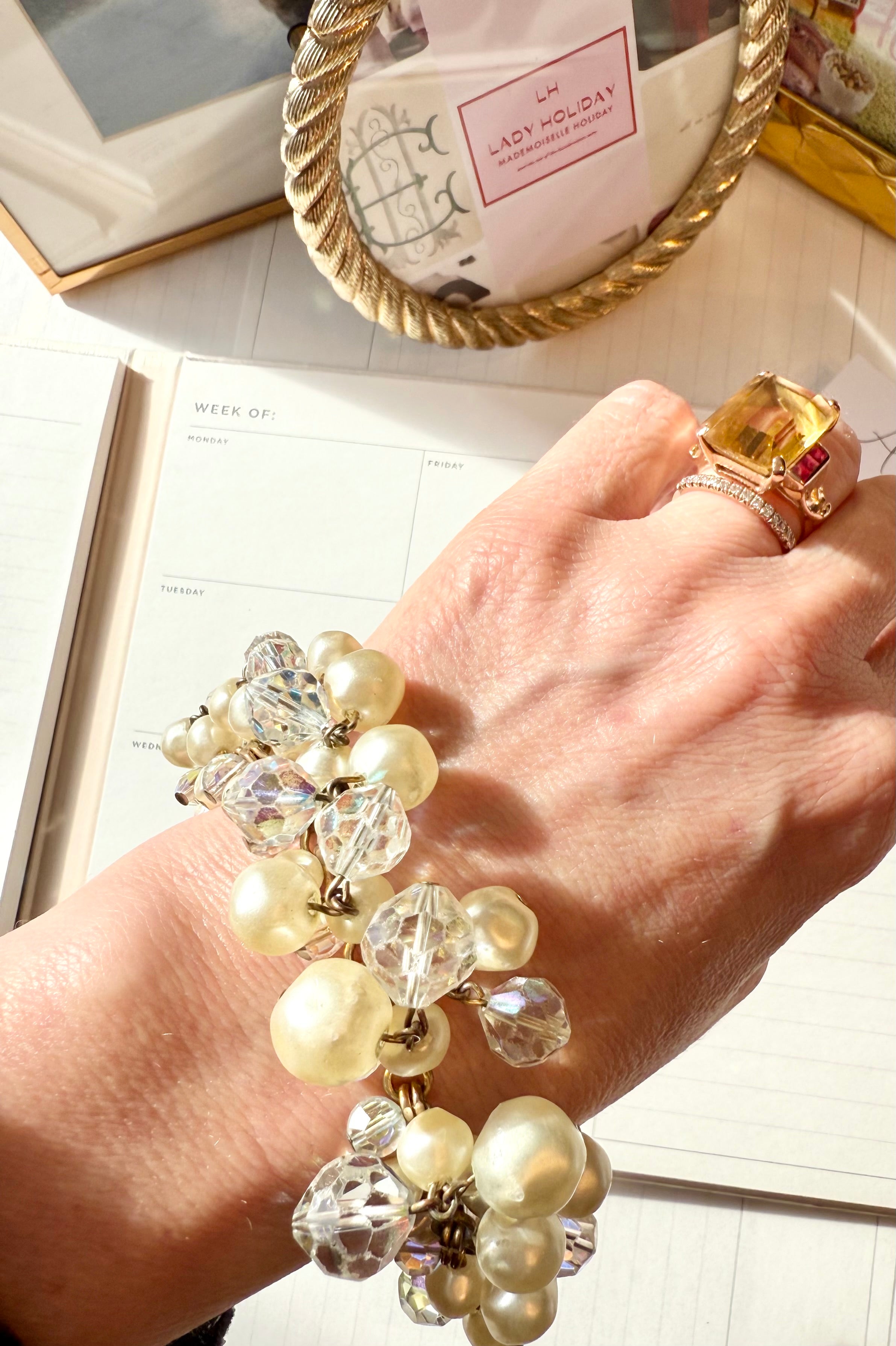 The most darling pearl, and glass charm bracelet... so chic