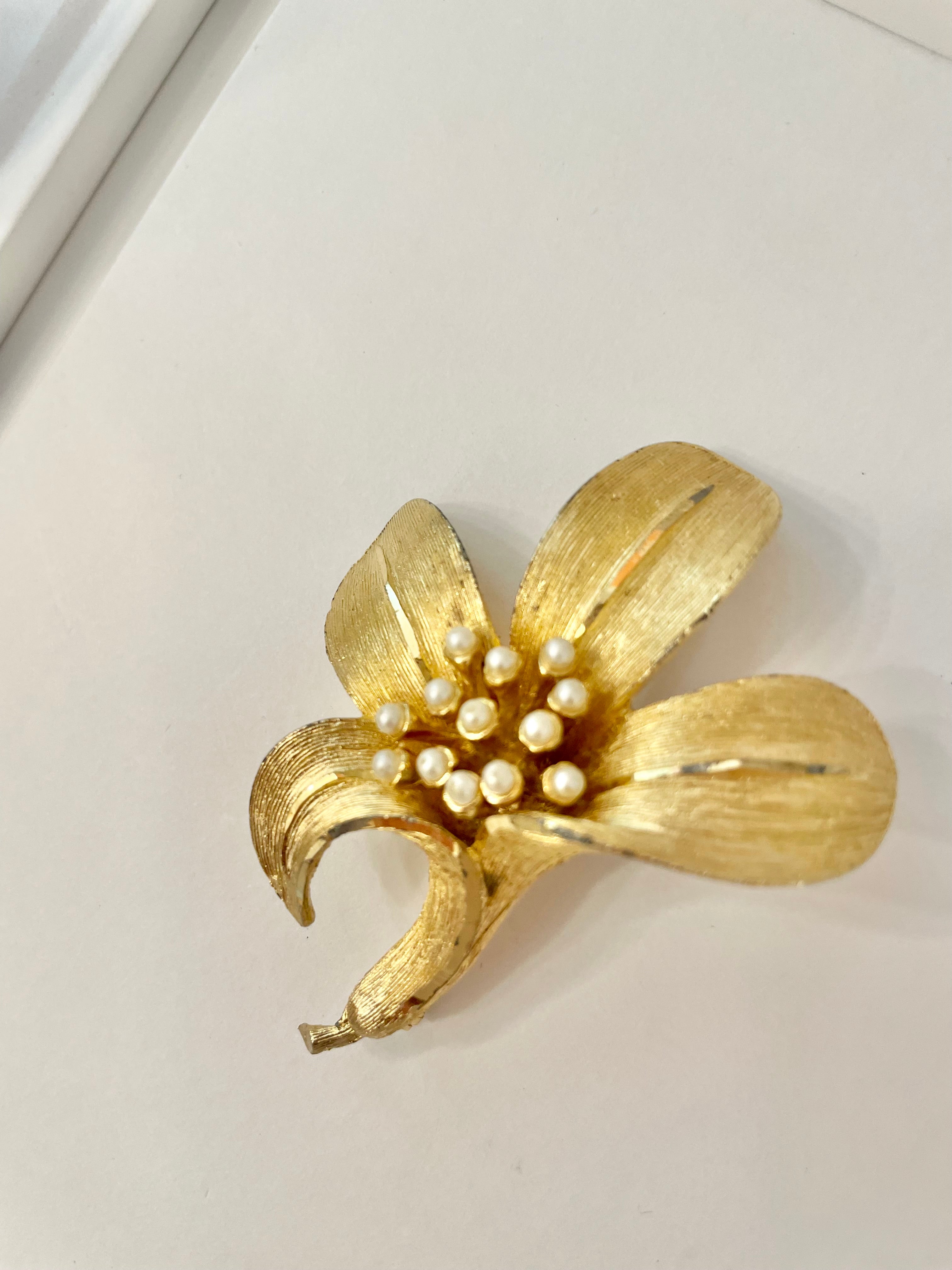 Isn't she charming... adores anything with pearls! This divine gold sculpted lily brooch is outstanding.