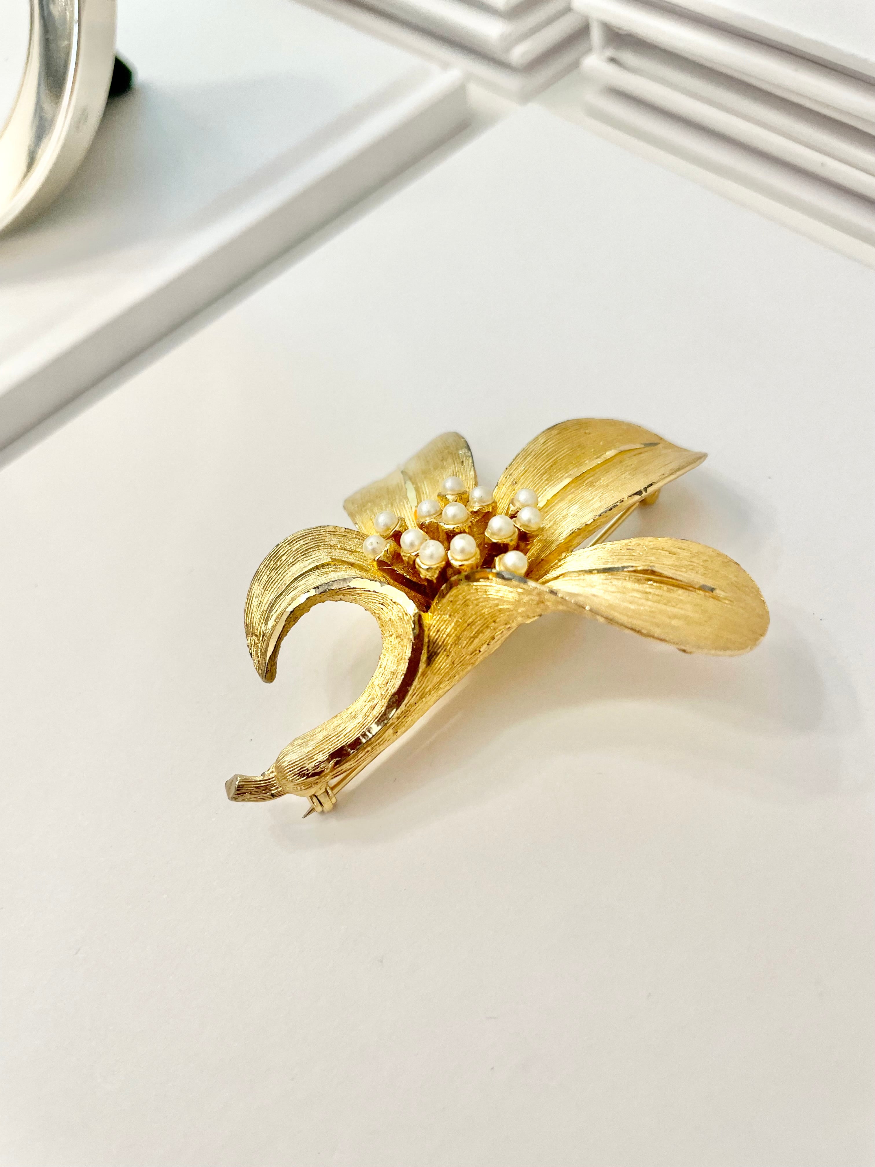 Isn't she charming... adores anything with pearls! This divine gold sculpted lily brooch is outstanding.