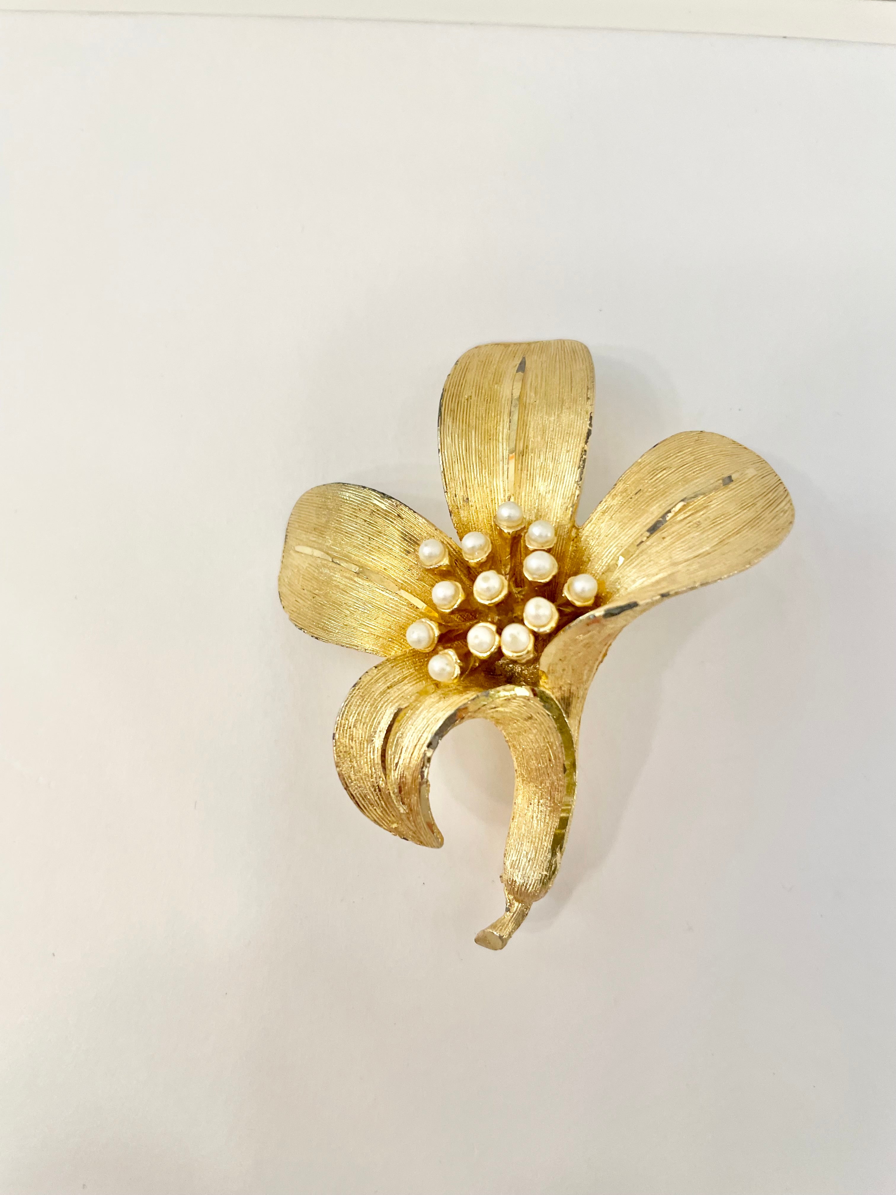 Isn't she charming... adores anything with pearls! This divine gold sculpted lily brooch is outstanding.