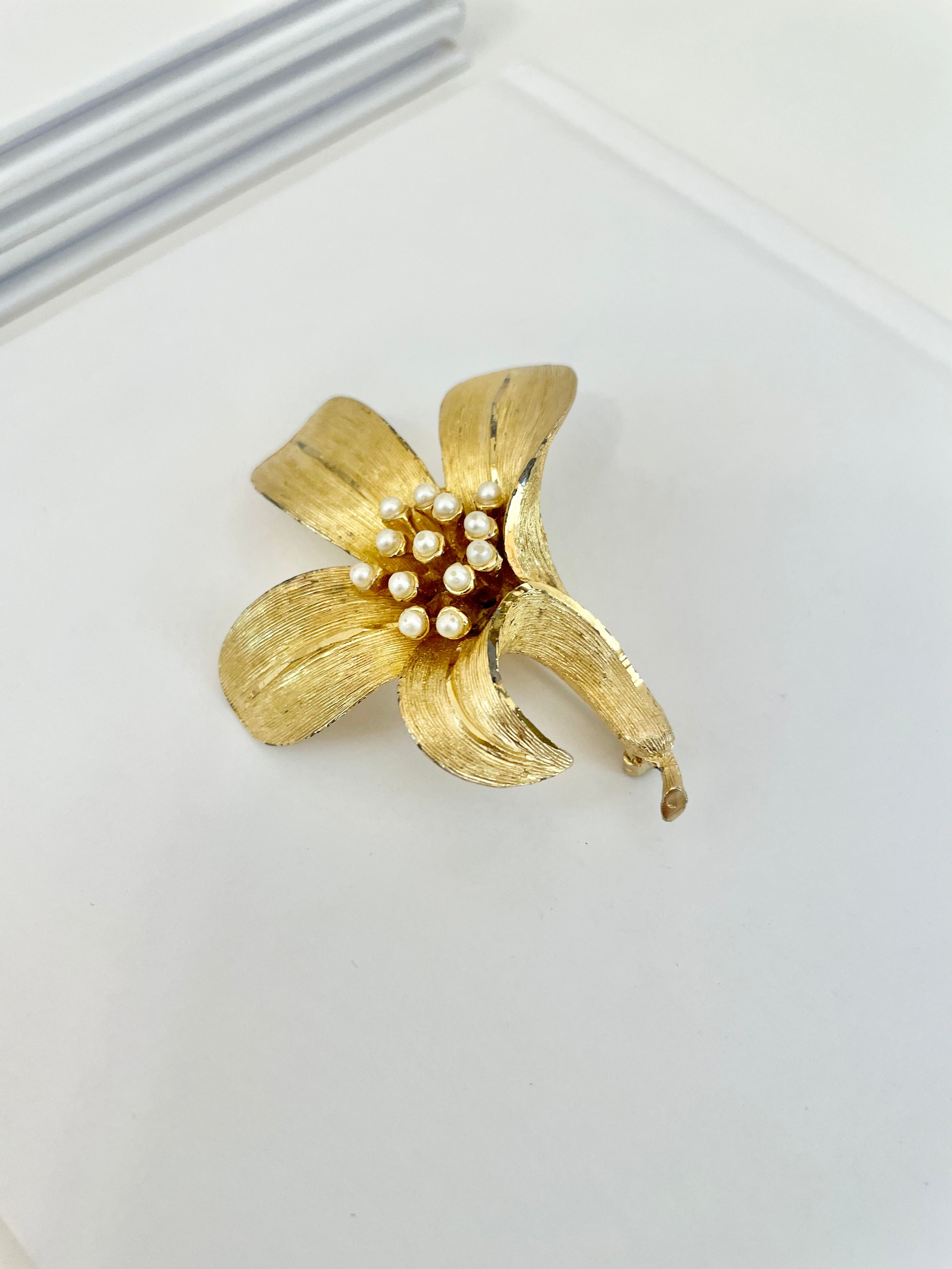 Isn't she charming... adores anything with pearls! This divine gold sculpted lily brooch is outstanding.