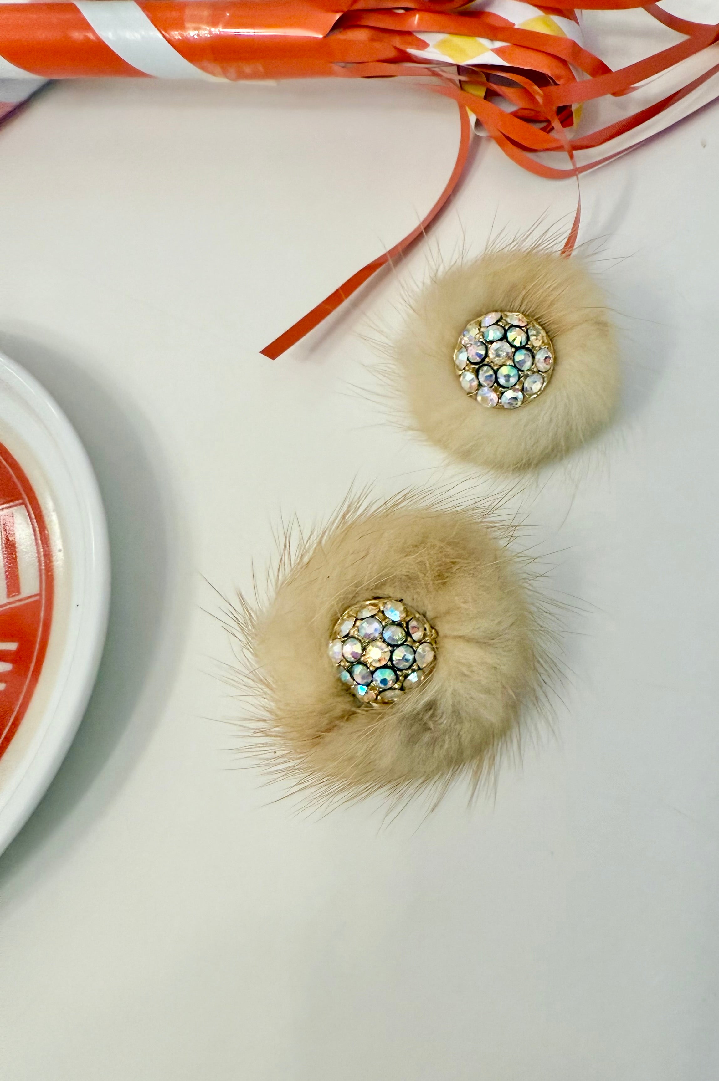 The mink button earring....